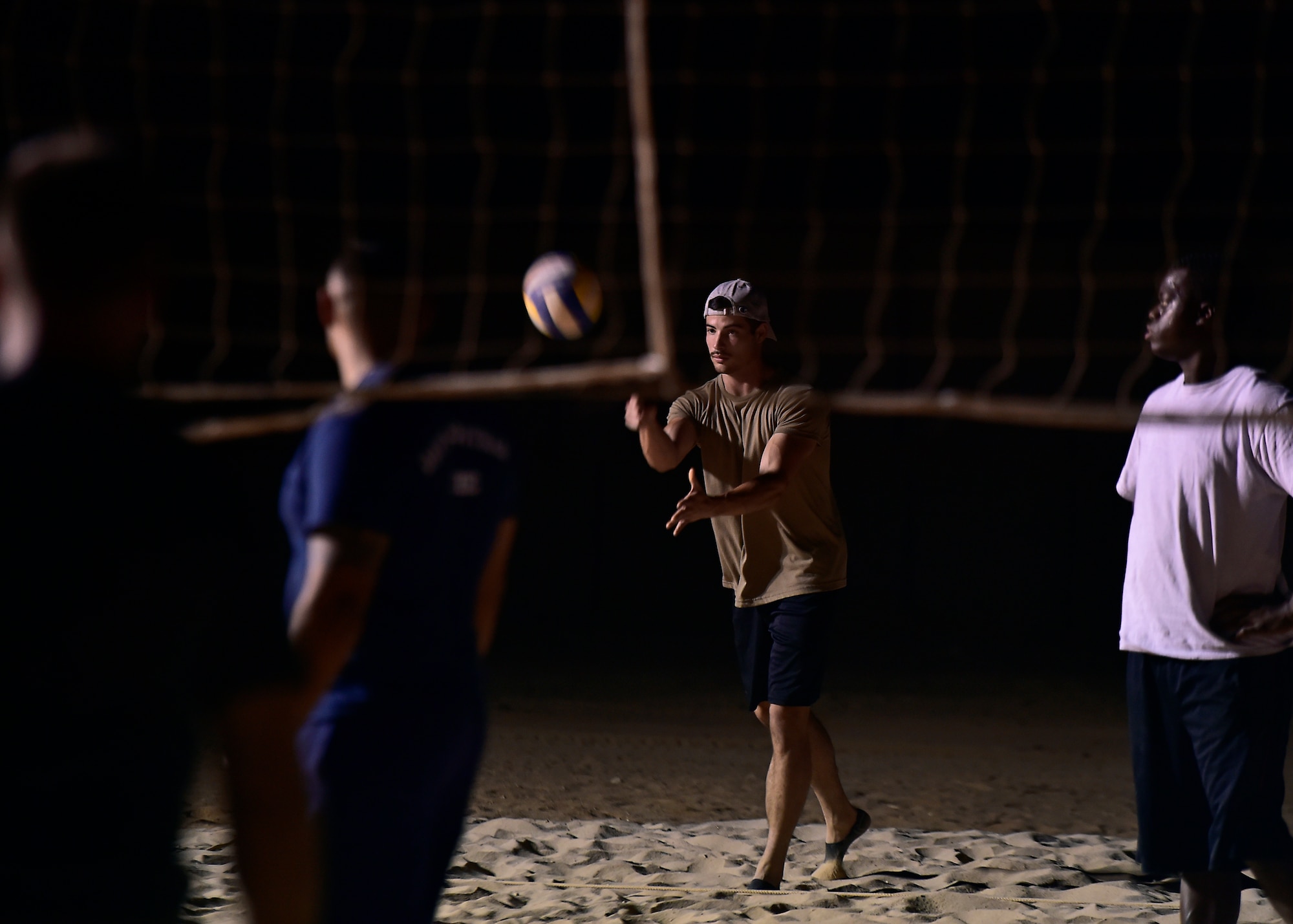 Airmen stationed at Prince Sultan Air Base, Kingdom of Saudi Arabia, compete in a volleyball tournament.