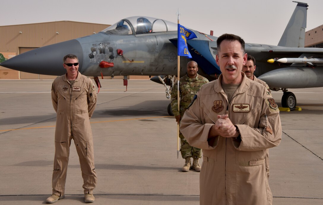 Col. Hurrelbrink, outgoing commander, relinquishes command of the 378th Expeditionary Operations Group to incoming commander, Col. Orgeron during the 378th EOG Change of Command Ceremony at Prince Sultan Air Base, Kingdom of Saudi Arabia.