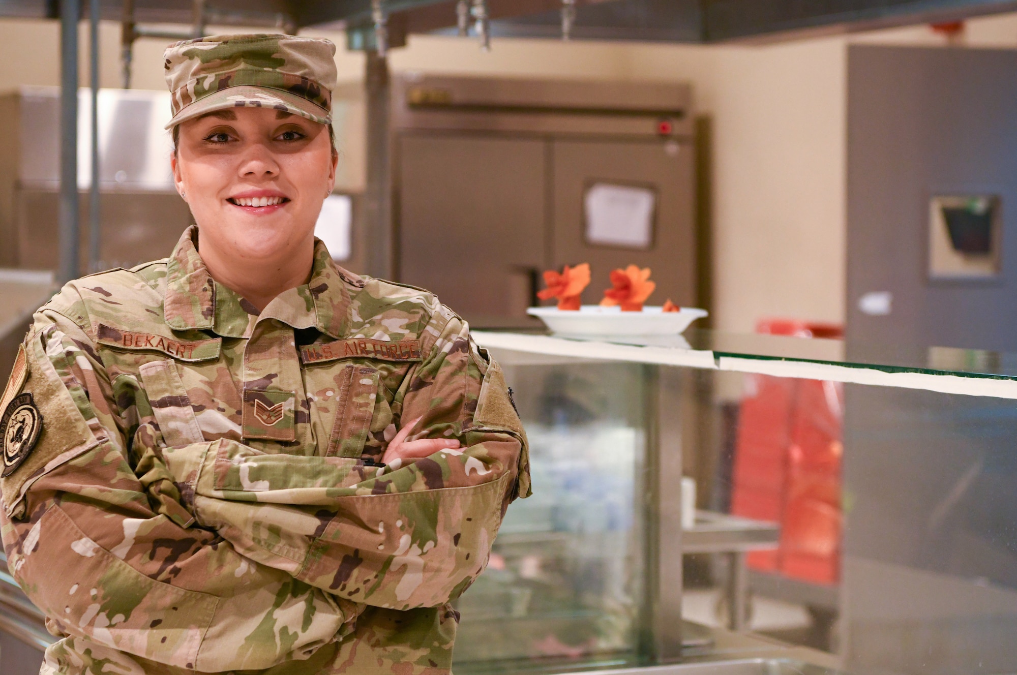 Staff Sgt. Allison Bekaert, 380th Expeditionary Force Support Squadron food production manager at Windy’s Dining Facility, along with other food service Airmen and contractors provide Agile Combat Support by serving more than 6,000 meals daily to warfighters across Al Dhafra Air Base, United Arab Emirates, July 7, 2020. More than 100 personnel run three dining facilities on base and ensure bottled water is accessible at all times to everyone on ADAB. (U.S. Air Force Photo by Tech. Sgt. Melissa Harvey)