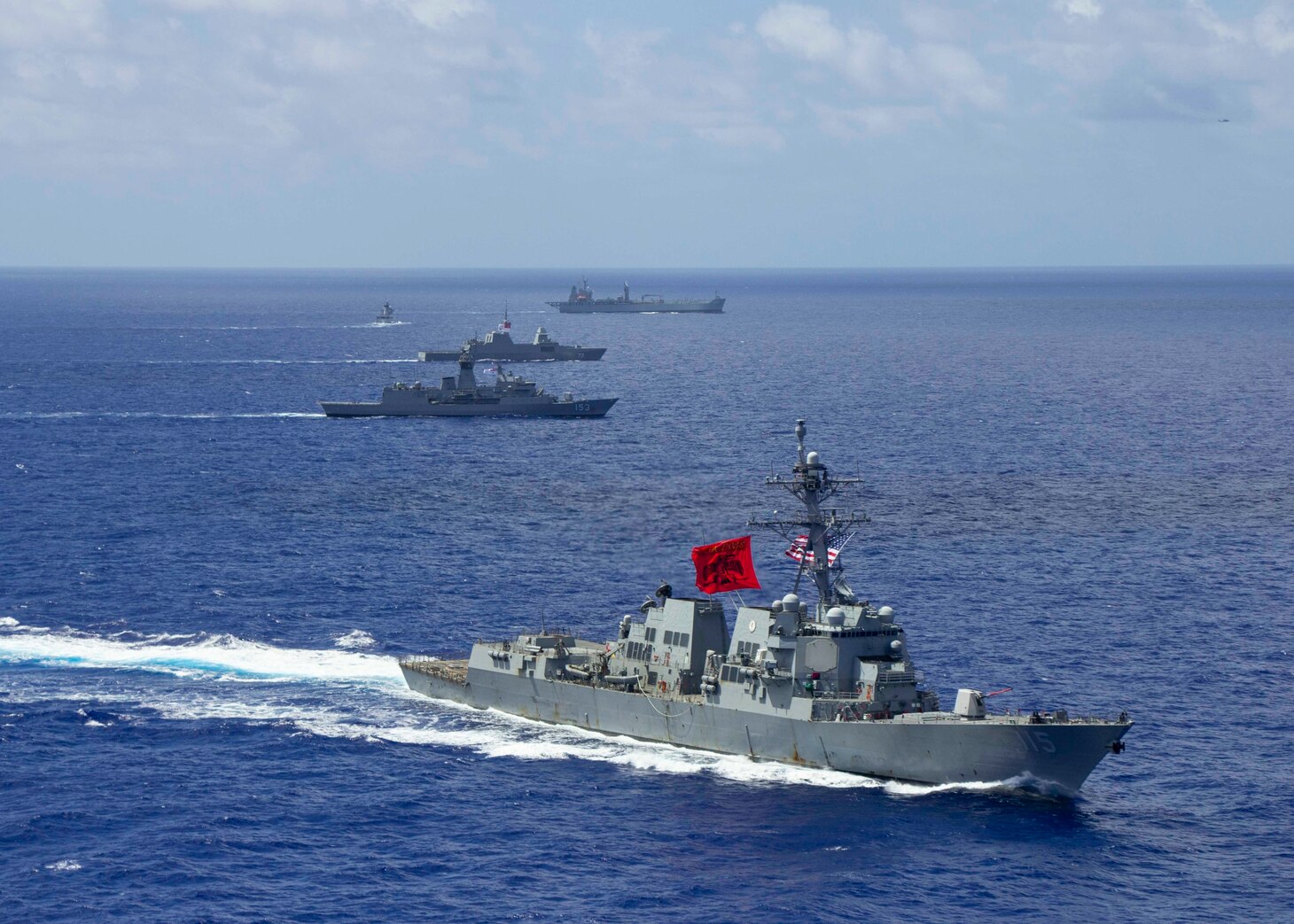The U.S. Navy Arleigh Burke-class guided-missile destroyer USS Rafael Peralta (DDG 115), front, the Royal Australian Navy Anzac-class frigate HMAS Stuart (FFH 153), the support ship HMAS Sirius (O 266), the Republic of Singapore Navy Formidable-class RSS Supreme (73) and the Royal Brunei Navy Darussalam-class offshore patrol vessel KDB Darulehsan (OPV-07) sail in formation as they transit the Pacific Ocean. Rafael Peralta is underway conducting operations in support of security and stability in the Indo-Pacific while assigned to Destroyer Squadron (DESRON) 15, the Navy's largest forward-deployed DESRON and the U.S. 7th Fleet's principal surface force. (U.S. Navy photo by Mass Communication Specialist 2nd Class Jason Isaacs)