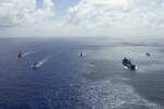 The U.S. Navy Arleigh Burke-class guided-missile destroyer USS Rafael Peralta (DDG 115), left, the Republic of Singapore Navy Formidable-class RSS Supreme (73), the Royal Australian Navy Anzac-class frigate HMAS Stuart (FFH 153), the support ship HMAS Sirius (O 266) and the Royal Brunei Navy Darussalam-class offshore patrol vessel KDB Darulehsan (OPV-07) sail in formation as they transit the Pacific Ocean. Rafael Peralta is underway conducting operations in support of security and stability in the Indo-Pacific while assigned to Destroyer Squadron (DESRON) 15, the Navy's largest forward-deployed DESRON and the U.S. 7th Fleet's principal surface force. (U.S. Navy photo by Mass Communication Specialist 2nd Class Jason Isaacs)