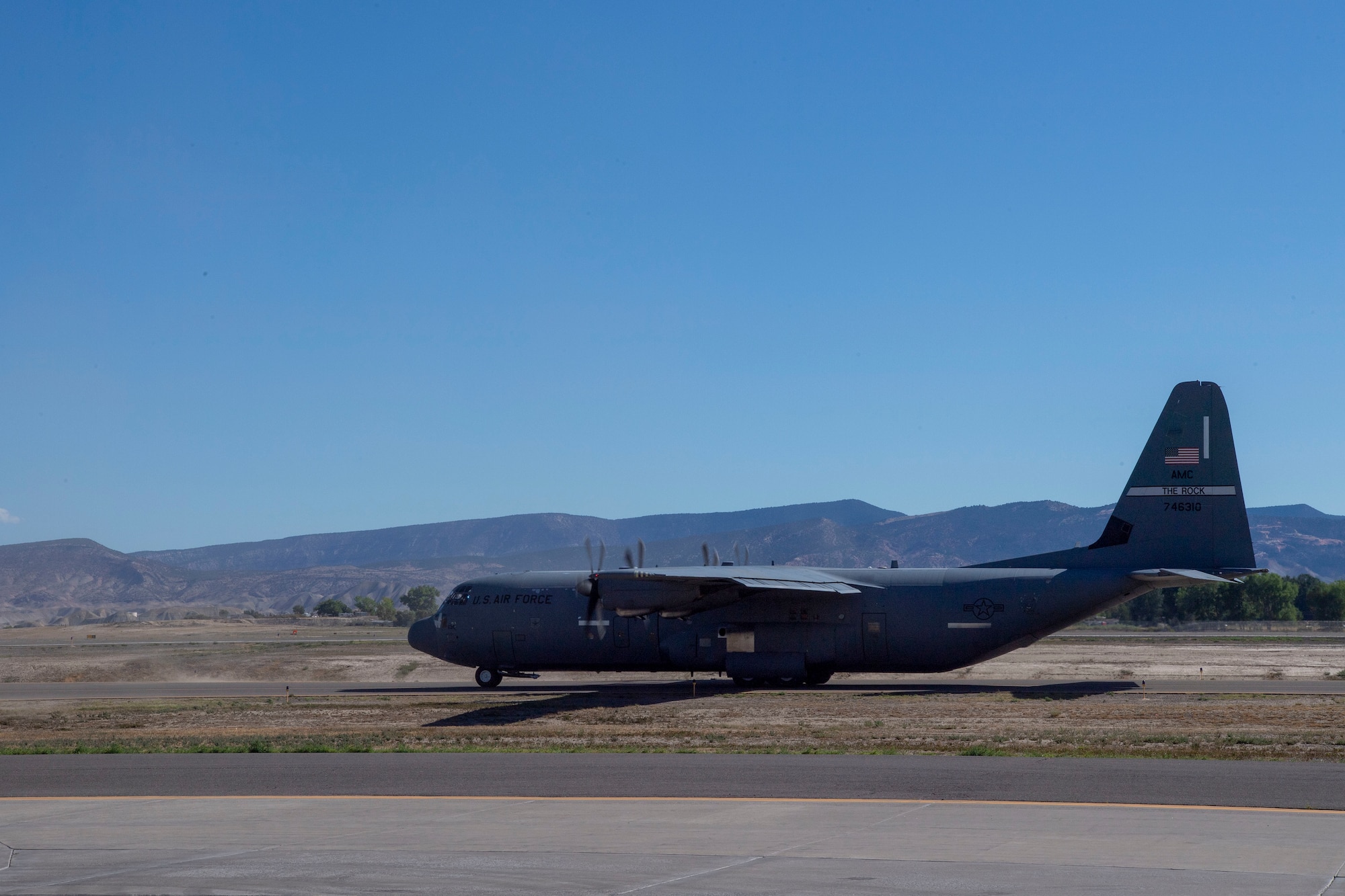 A C-130J Super Hercules prepares for takeoff during pre-deployment training at Montrose Regional Airport, Colorado, July 27, 2020. This training is part of the 4/12 deployment initiative, which was developed in 2019 between airlift squadrons from Dyess Air Force Base, Texas and Little Rock AFB, allowing each squadron a full year of dwell time followed by a four-month rotation to their respective area of responsibility. (U.S. Air Force photo by Airman 1st Class Aaron Irvin)