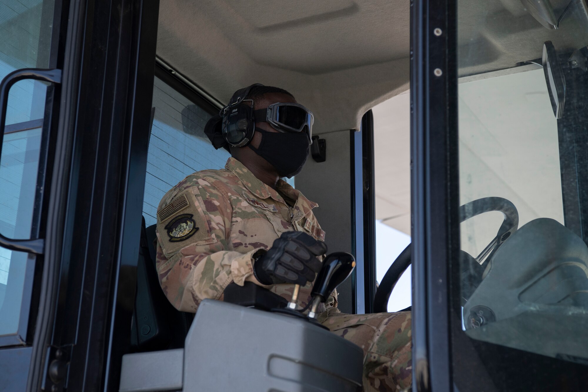 Senior Airman Kyle Powell, 821st Contingency Response Squadron, loads cargo onto a C-130J Super Hercules during pre-deployment training at Guernsey Airport, Wyoming, July 27, 2020. This training is part of the 4/12 deployment initiative, which was developed in 2019 between airlift squadrons from Dyess Air Force Base, Texas and Little Rock AFB, allowing each squadron a full year of dwell time followed by a four-month rotation to their respective area of responsibility. (U.S. Air Force photo by Airman 1st Class Aaron Irvin)