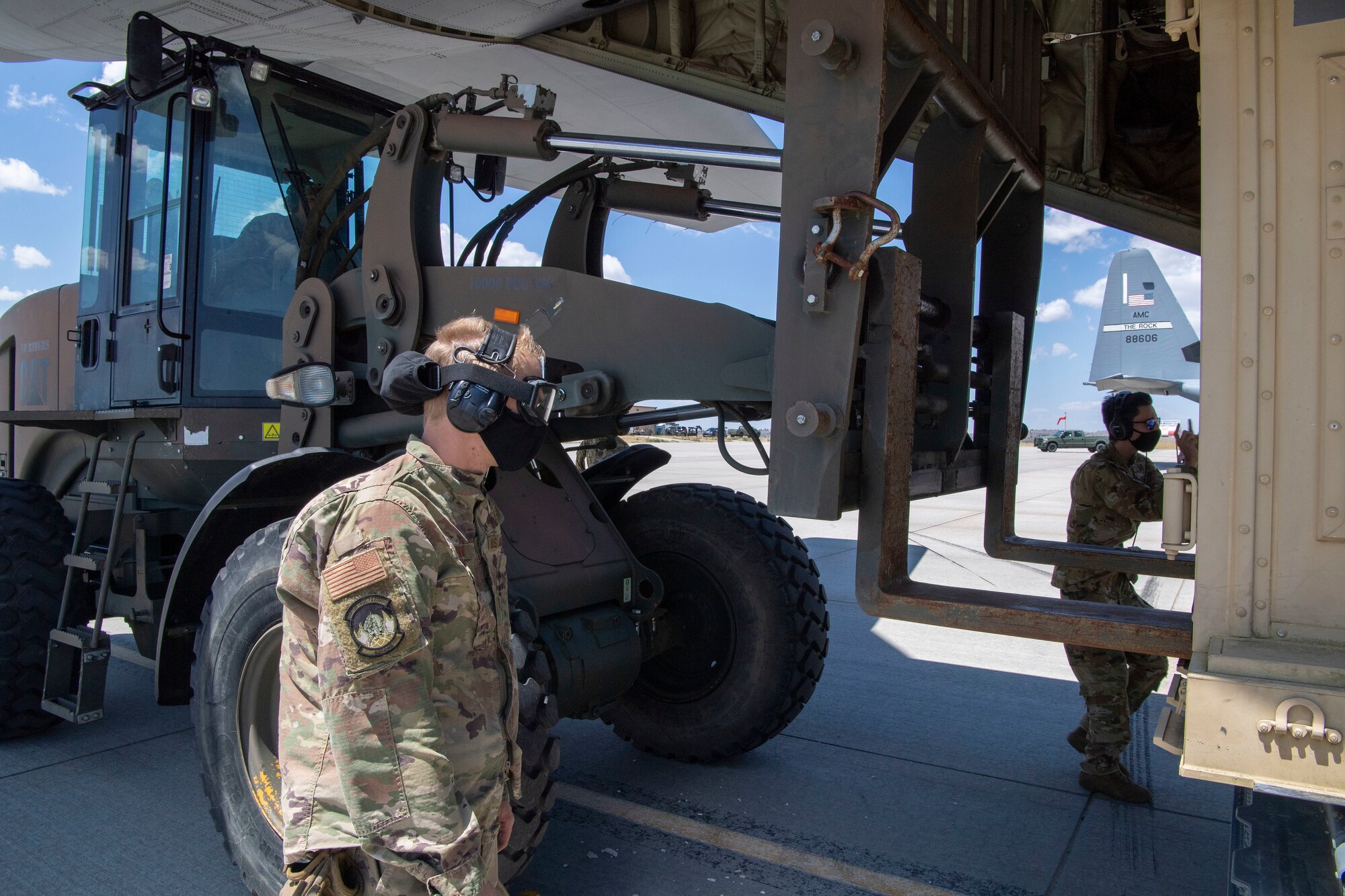 Airmen assigned to the 821st Contingency Response Squadron load cargo onto a C-130J Super Hercules during pre-deployment training at Guernsey Airport, Wyoming, July 27, 2020. This training is part of the 4/12 deployment initiative, which was developed in 2019 between airlift squadrons from Dyess Air Force Base, Texas and Little Rock AFB, allowing each squadron a full year of dwell time followed by a four-month rotation to their respective area of responsibility. (U.S. Air Force photo by Airman 1st Class Aaron Irvin)