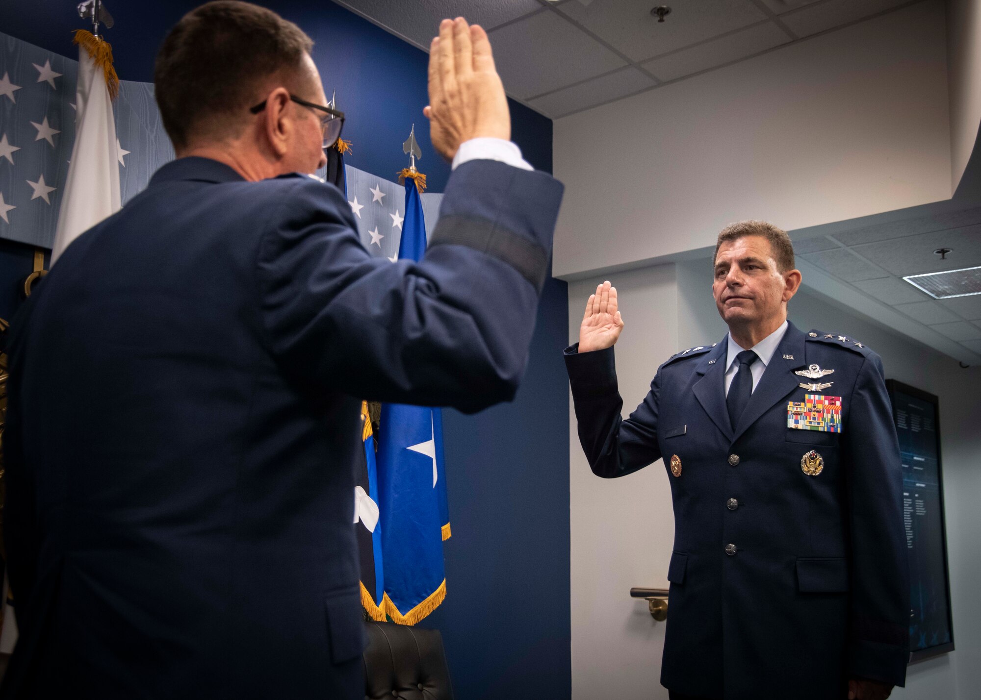 U.S. Air Force Gen. Joseph L. Lengyel, the 28th Chief of the National Guard Bureau, conducts a transition of responsibility order for newly promoted Lt. Gen. Michael A. Loh during a Change of Responsibility ceremony at the Pentagon July 28, 2020. During the ceremony, Loh assumed responsibility as the 13th director of the Air National Guard and was promoted to the rank of lieutenant general. (U.S. Air National Guard photo by Technical Sgt. Morgan R. Lipinski)