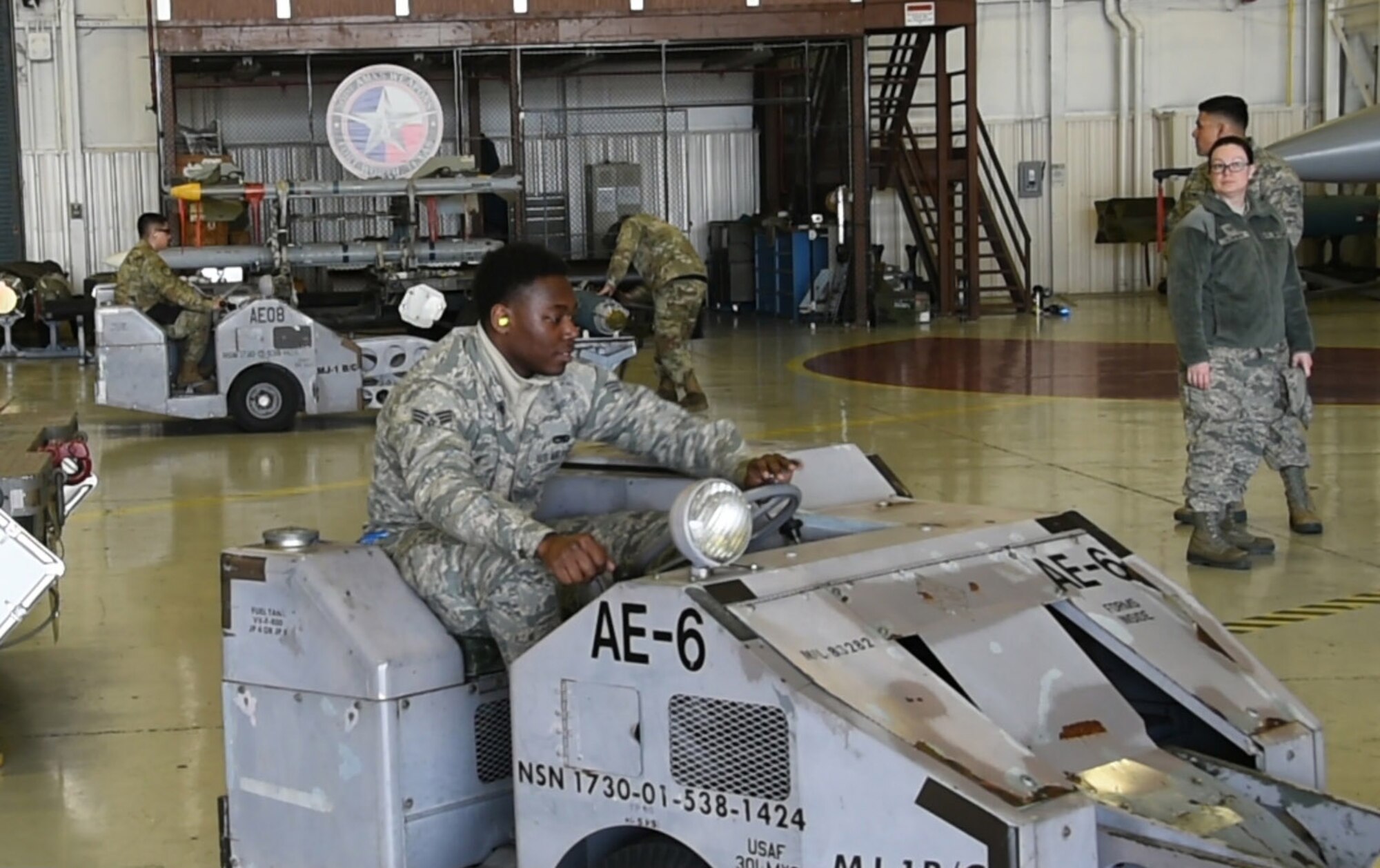 Senior Airman Justin Tillis, 301st Fighter Wing Maintenance Squadron three man, drives a jammer during the weapons loading competition at U.S. Naval Air Station Joint Reserve Base Fort Worth, Texas on Jan. 12, 2020. A Jammer is a vehicle used to transport and load munitions onto aircrafts. (U.S. Air Force photo by Tech. Sgt. Charles Taylor)