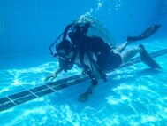 200723-A-FC661-1006 NAVAL SUPPORT ACTIVITY BAHRAIN (July 23, 2020) An explosive ordnance disposal technician, assigned to Task Group (TG) 56.1, conducts underwater training onboard Naval Support Activity Bahrain in support of the virtual training presentations developed for Exercise Resolute Union 20, July 23, 2020. Resolute Union 20 is a part of a series of bilateral exercises between the Lebanese Armed Forces and U.S. Navy focused on explosive ordnance disposal and maritime security operations. (U.S. Army photo by Spc. Josh DuRant)