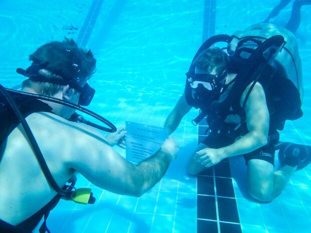 200723-A-FC661-1011 NAVAL SUPPORT ACTIVITY BAHRAIN (July 23, 2020) Explosive ordnance disposal technicians, assigned to Task Group (TG) 56.1, conduct underwater training onboard Naval Support Activity Bahrain in support of the virtual training presentations developed for Exercise Resolute Union 20, July 23, 2020. Resolute Union 20 is a part of a series of bilateral exercises between the Lebanese Armed Forces and U.S. Navy focused on explosive ordnance disposal and maritime security operations. (U.S. Army photo by Spc. Josh DuRant)