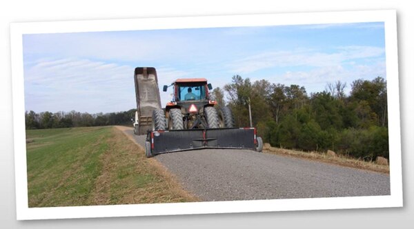 IN THE PHOTO, a levee is being resurfaced.