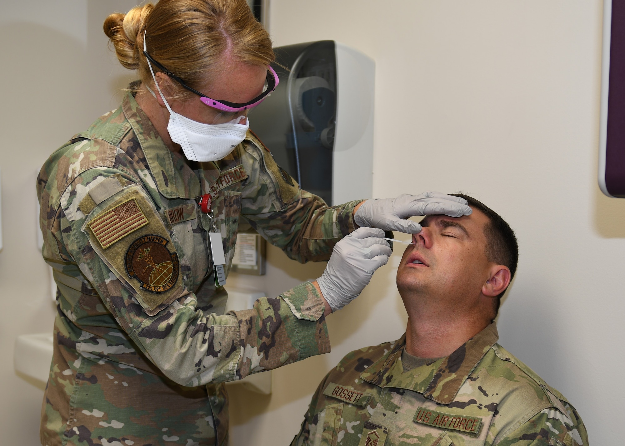 Senior Airman Chelsea Barrow, 22nd Operational Medical Readiness Squadron Independent Duty Medical Technician, administers a COVID-19 test to Master Sgt. Elliott Gossett, 22nd Logistics Readiness Squadron fuels operations section chief, at the flight medical clinic July 17, 2020, at McConnell Air Force Base, Kansas. McConnell initiated testing as an added step in the deployment process to help keep our Airmen safe, thus minimizing the spread of COVID-19 while maintaining mission readiness. (U.S. Air Force photo by Tech. Sgt. Jennifer Stai)