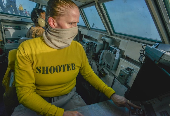 Aircraft shooter Lt. Amy Blades-Langjahr, from Casper, Wyo., test fires a catapult in the bow bubble on the flight deck aboard the aircraft carrier USS Nimitz (CVN 68).