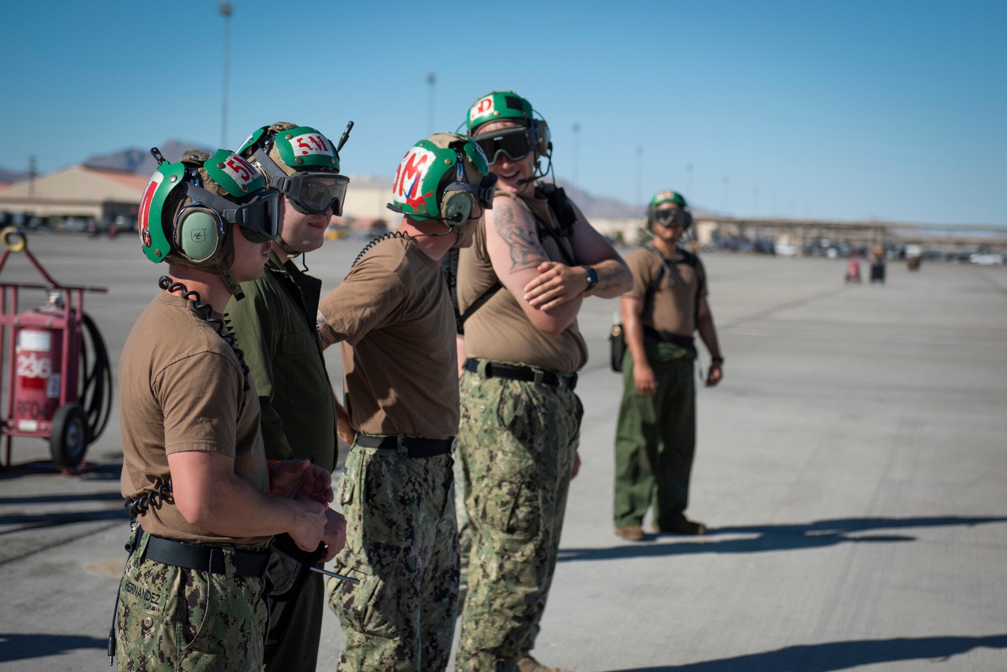Airmen talk on the flight line