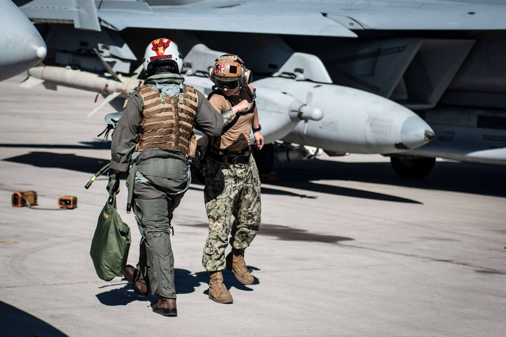 Airmen greet each other.