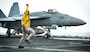 ARABIAN SEA (July 26, 2020) Lt. Amy Blades-Langjahr, from Casper, Wyo., signals an F/A-18E Super Hornet, from the “Kestrels” of Strike Fighter Squadron (VFA) 137, to launch off from the flight deck of the aircraft carrier USS Nimitz (CVN 68). Nimitz, the flagship of Nimitz Carrier Strike Group, is deployed to the U.S. 5th Fleet area of operations to ensure maritime stability and security in the Central Region, connecting the Mediterranean and Pacific through the Western Indian Ocean and three critical chokepoints to the free flow of global commerce. (U.S. Navy photo by Mass Communication Specialist 3rd Class Sarah Christoph/Released)