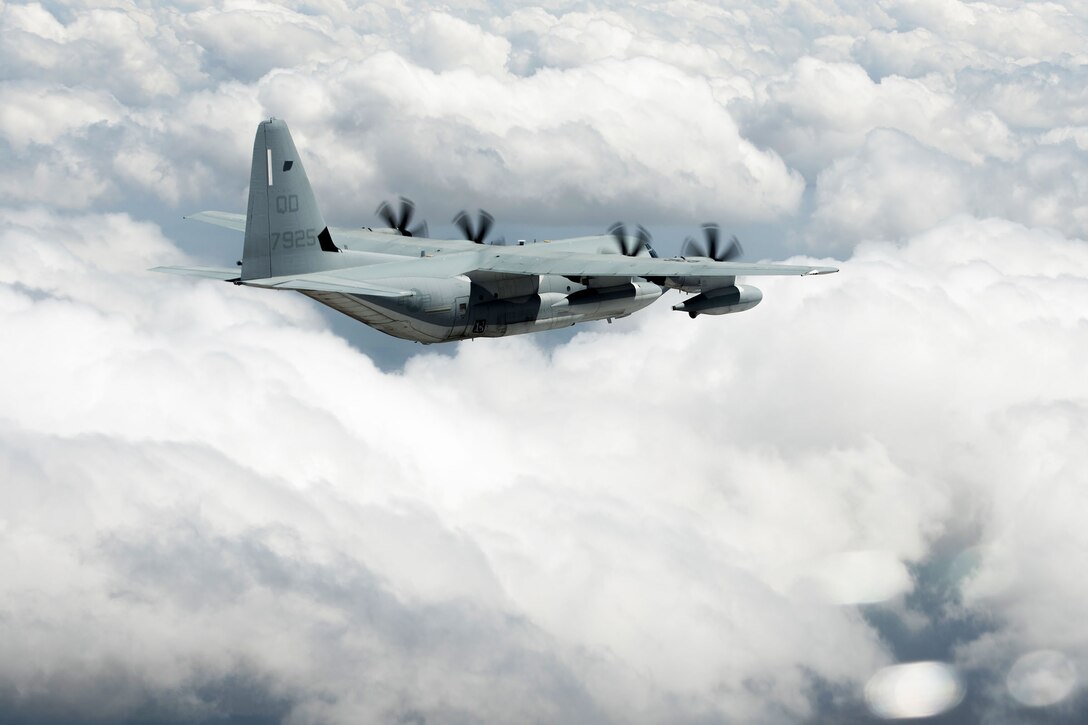 U.S. Marines pilot a KC-130 Hercules from Marine Aerial Refueler Transport Squadron 152 (VMGR-152), over Northern Territory, Australia, Aug. 17, 2018. Two KC1-30s from VMGR-152 took part in aerial refueling of MV-22 Osprey as part of the Osprey pilots’ recertification process during Marine Rotational Force – Darwin 18.