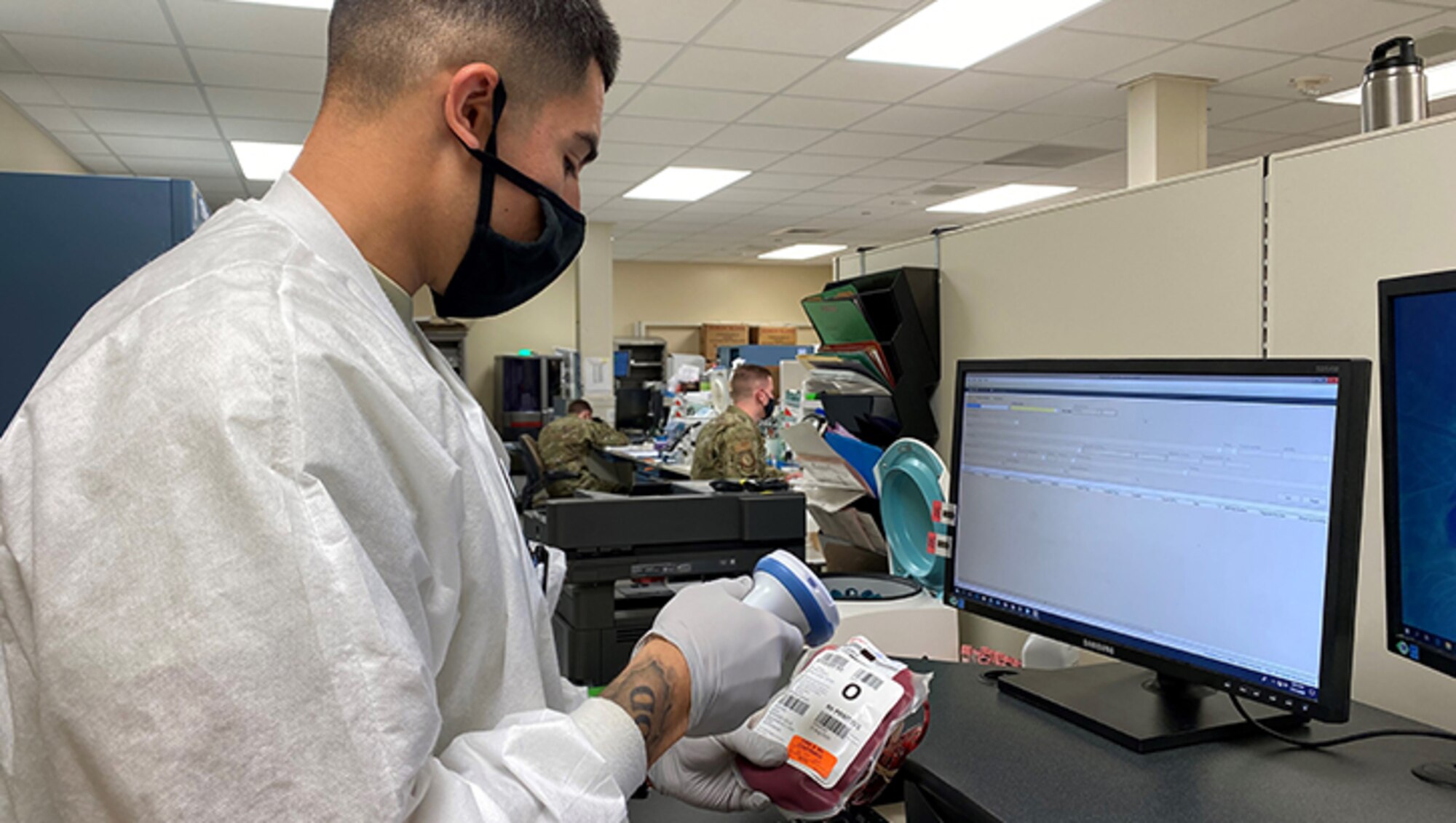Image of an Airman scanning a unit of blood.