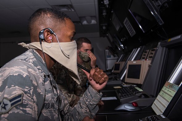 Airman 1st Class Brandon Roland, 27th Special Operations Support Squadron air traffic control apprentice, checks the intended flight plan for an aircraft at Cannon Air Force Base, N.M., July 23, 2020. The radar approach control facility gives guidance to all aircraft passing through their air space, whether they are military or civilian. (U.S. Air Force photo by Senior Airman Vernon R. Walter III)
