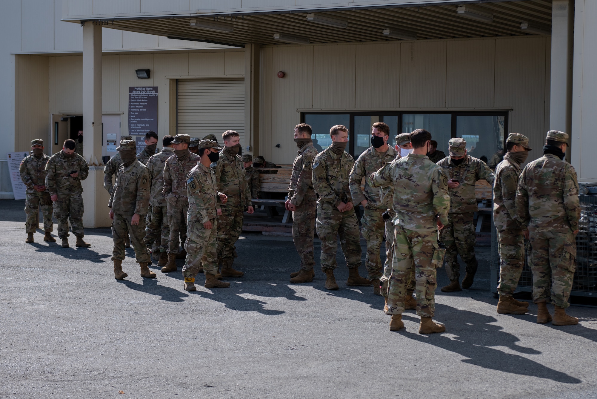 Army soldiers prep for training and receive gear to perform jump training.