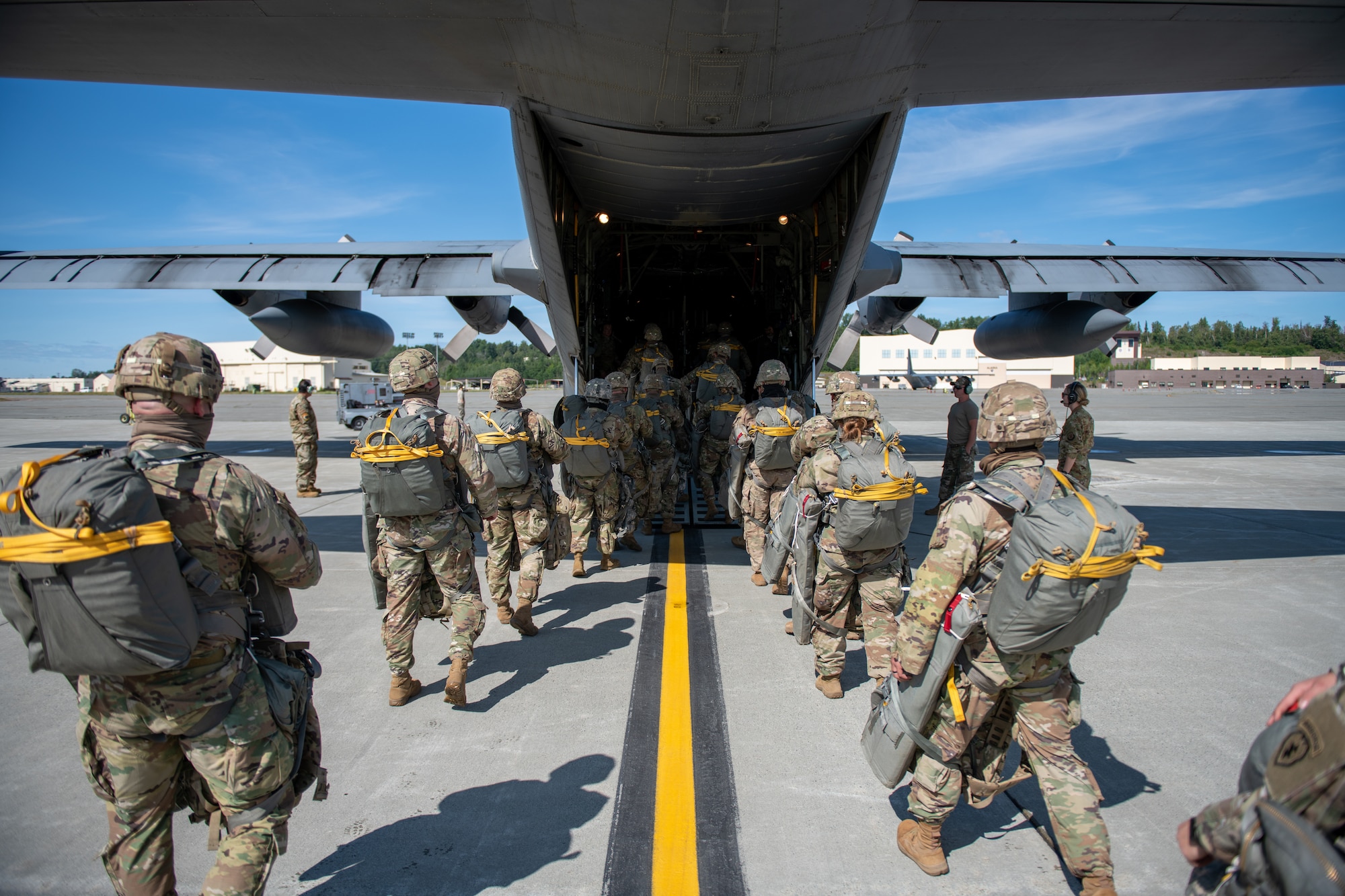 Army soldiers board a C-310 aircraft.