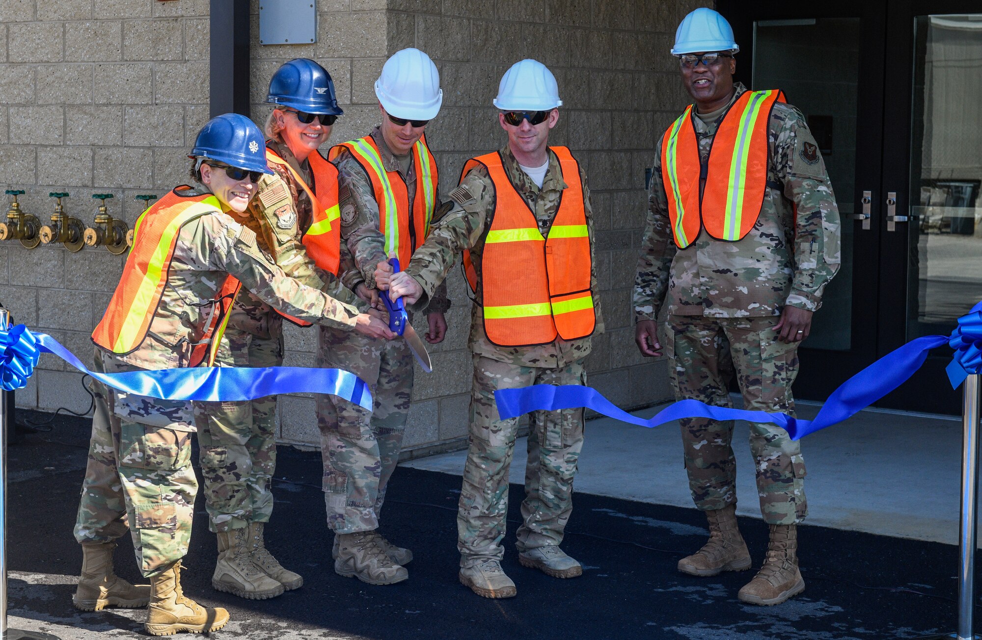 Leadership of the 341st Missile Wing cut a ribbon during the ceremony for the new Tactical Response Force/Helicopter Operations Alert Facility Aug. 4, 2020, at Malmstrom Air Force Base, Mont.