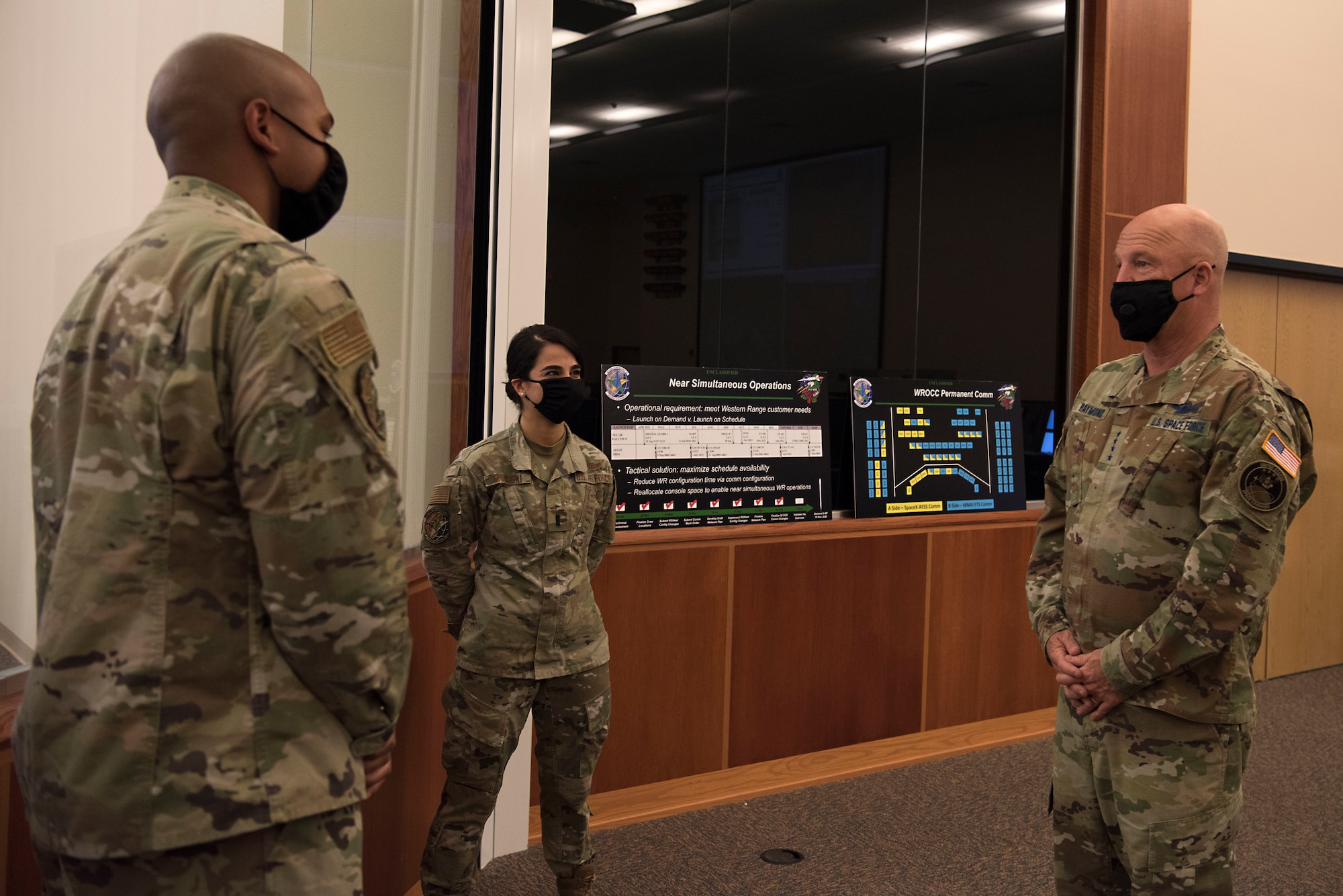 Gen. Jay Raymond, U.S. Space Force Chief of Space Operations and commander of U.S. Space Command, is briefed by 1st Lt. Melanie Mohseni and 1st Lt. Byron Baker, 2nd Range Operation Squadron, while touring the 30th Space Wing’s Western Range Operation Control Center Aug. 3, 2020 at Vandenberg Air Force Base, Calif.