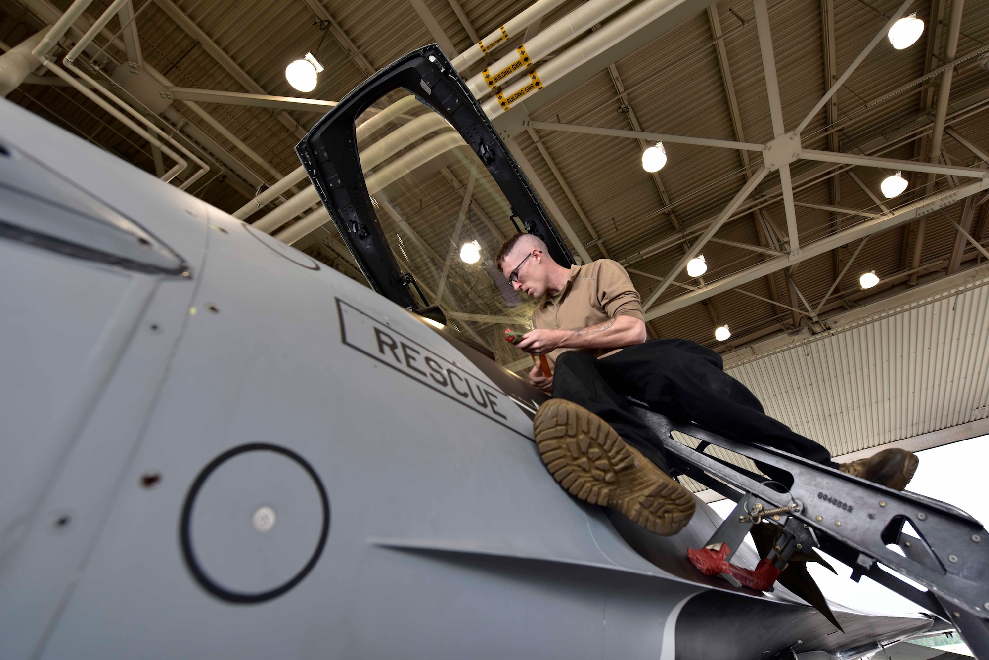 U.S. Air Force Senior Airman Joshua Zacharko, an 18th Aircraft Maintenance Unit (AMU) crew chief, inspects the cockpit of an F-16 Fighting Falcon aircraft during RED FLAG-Alaska 20-3 on Eielson Air Force Base, Alaska, Aug. 4, 2020. The 18th AMU provides heavy aircraft maintenance and munitions support for the wing's F-16 Fighting Falcon aircraft. (U.S. Air Force photo by Senior Airman Beaux Hebert)