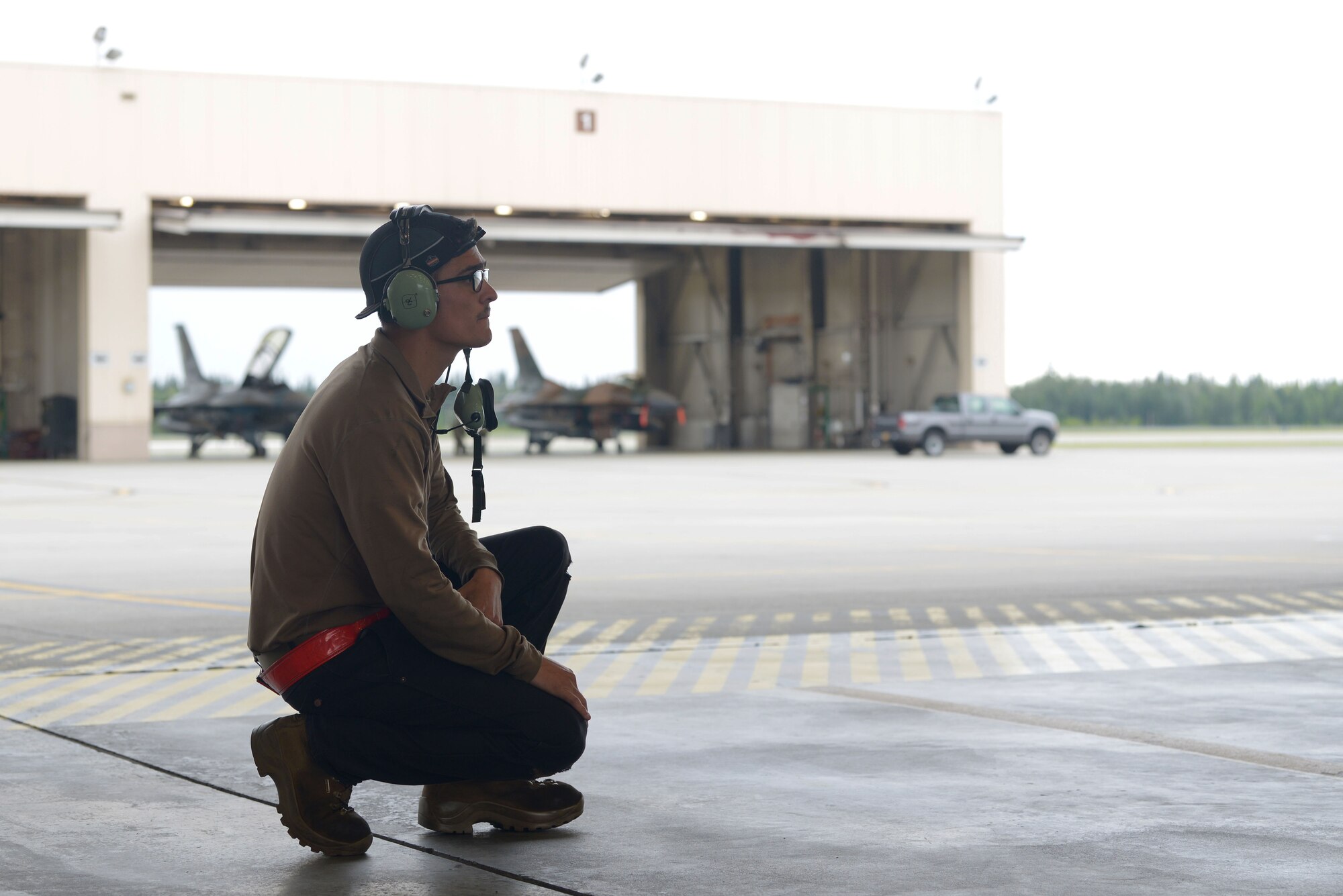 U.S. Air Force Airman 1st Class Jacob Camacho, an 18th Aircraft Maintenance Unit (AMU) crew chief, conducts preflight checks on an F-16 Fighting Falcon aircraft during RED FLAG-Alaska 20-3 on Eielson Air Force Base, Alaska, Aug. 4, 2020. Aircraft maintainers perform pre-, post- and between-flight safety and function checks, ensuring aircraft are mission-ready at a moment’s notice. (U.S. Air Force photo by Senior Airman Beaux Hebert)