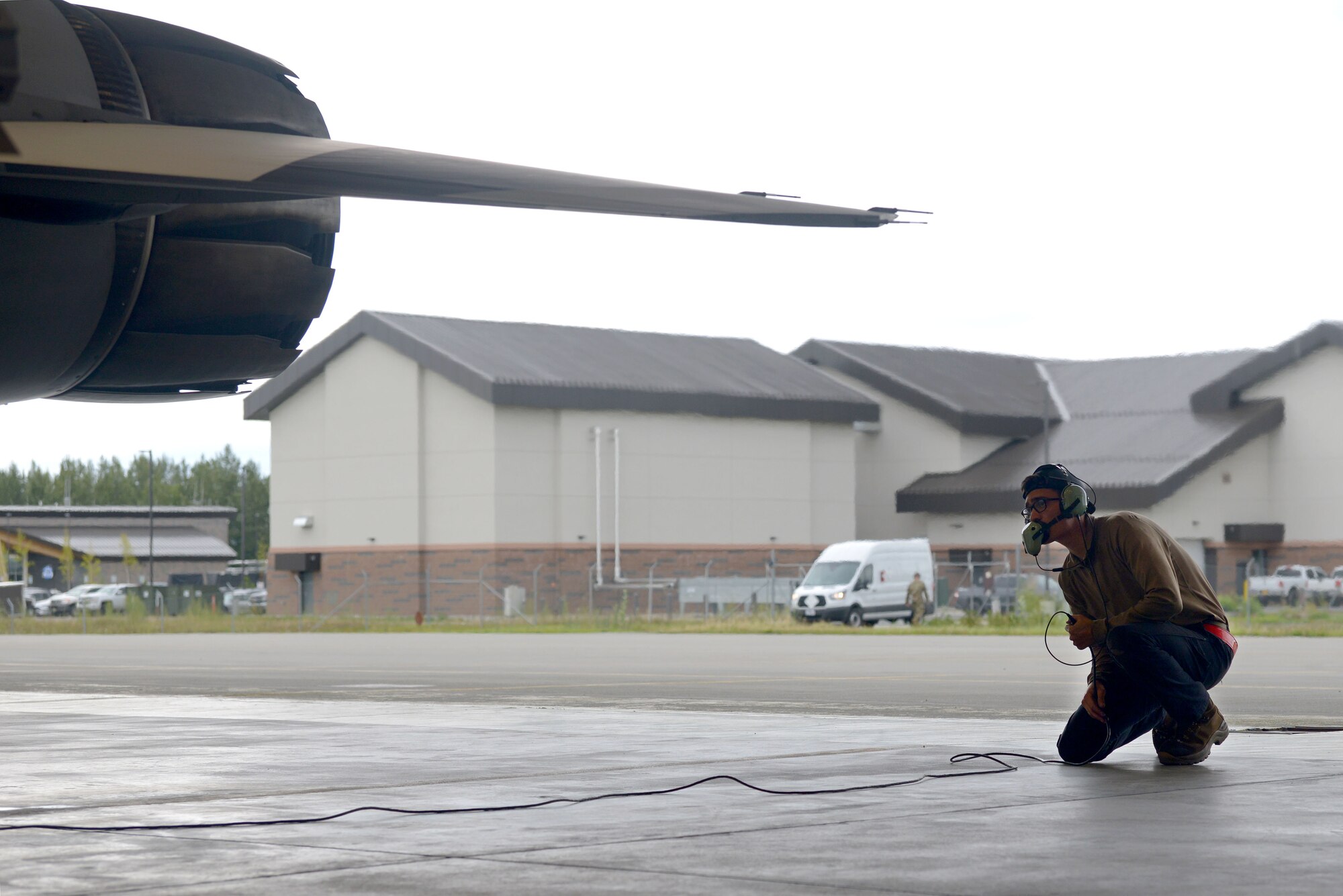 U.S. Air Force Airman 1st Class Jacob Camacho, an 18th Aircraft Maintenance Unit (AMU) crew chief, inspects the back of an F-16 Fighting Falcon aircraft during RED FLAG-Alaska 20-3 on Eielson Air Force Base, Alaska, Aug. 4, 2020. The 18th AMU provides aircraft and munitions maintenance support to the 354th Fighter Wing's aggressor aircraft operating at Eielson AFB.  (U.S. Air Force photo by Senior Airman Beaux Hebert)