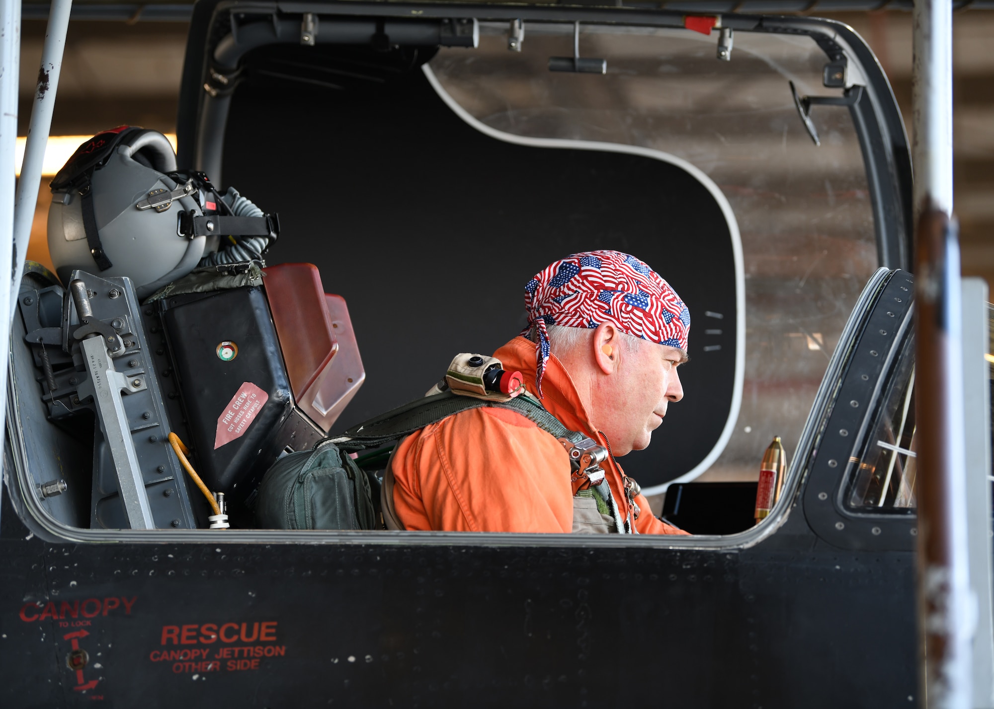 Retired Lt. Col Jonathan Huggins, 1st Reconnaissance Squadron U-2 instructor pilot, performs a preflight inspection before takeoff July 31, 2020 at Beale Air Force Base, California. Civilian U-2 instructor pilots don an orange flight suit, symbolic to the history of the U-2 pilots who wore them in the past. (U.S. Air Force photo by Airman 1st Class Luis A. Ruiz-Vazquez)