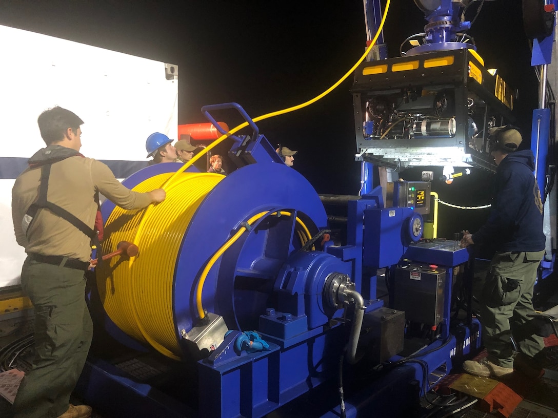 Sailors from Undersea Rescue Command deploy the Sibitzky Remotely Operated Vehicle (ROV) from the deck of the Military Sealift Command-chartered merchant vessel HOS Dominator. Undersea Rescue Command is aiding in recovery of the missing seven Marines and one Sailor from the 15th Marine Expeditionary Unit. (U.S. Navy photo by LT Curtis Khol/Released)