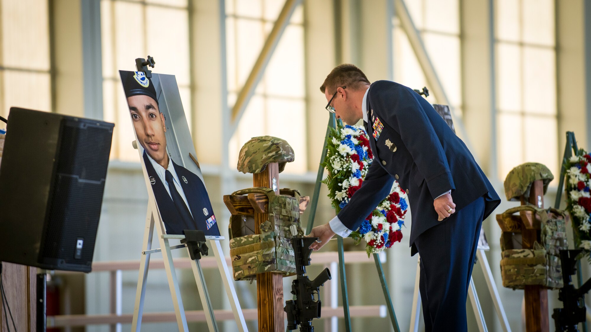 Lt. Col. Joseph A Bincarousky Sr., the 412th Security Forces Squadron Commander, presents a posthumous Air Force Achievement Medal to Staff Sgt. Kylle White, at Edwards Air Force Base, California, Aug. 3. (Air Force photo by Giancarlo Casem)