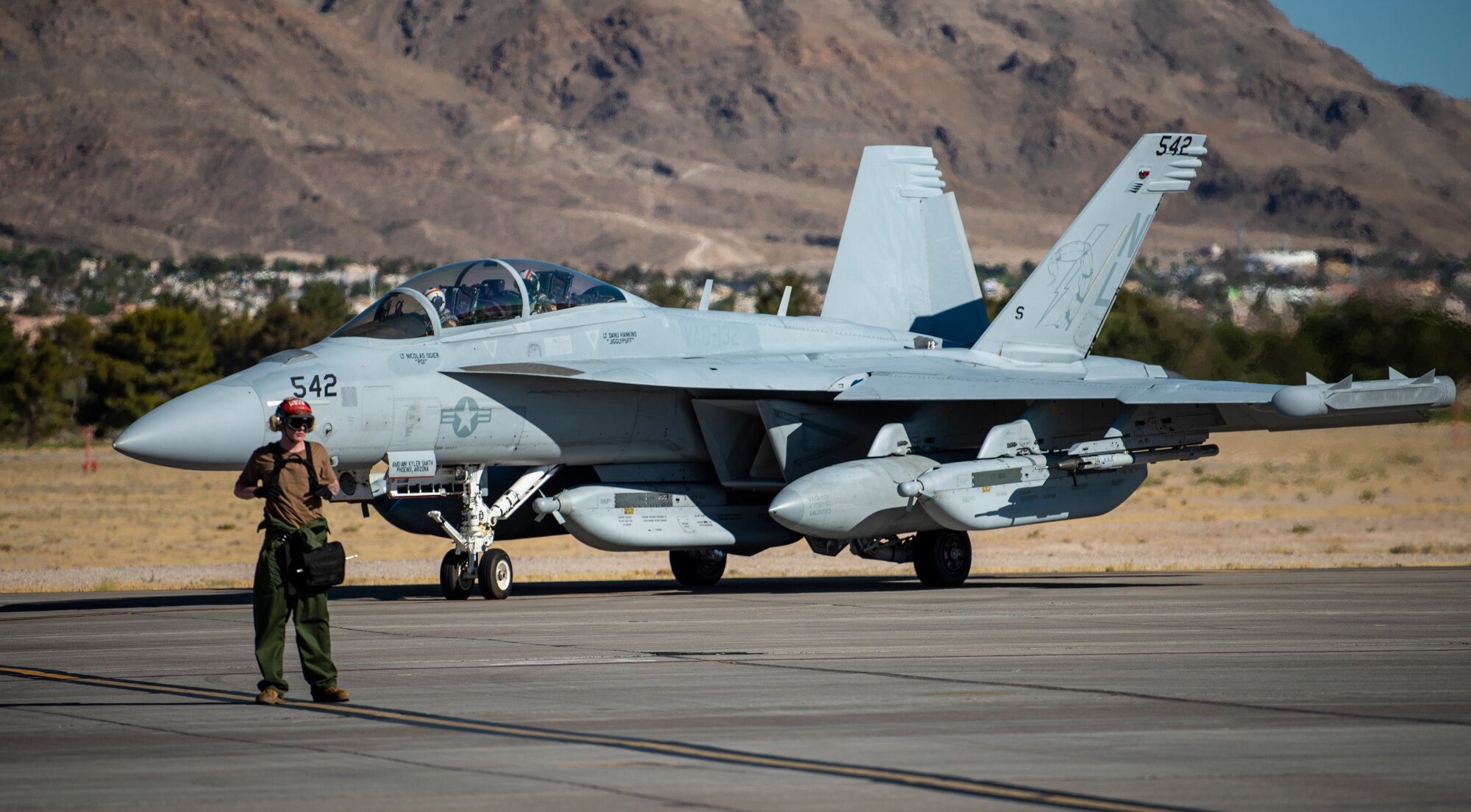 Airman stands on the flight line.