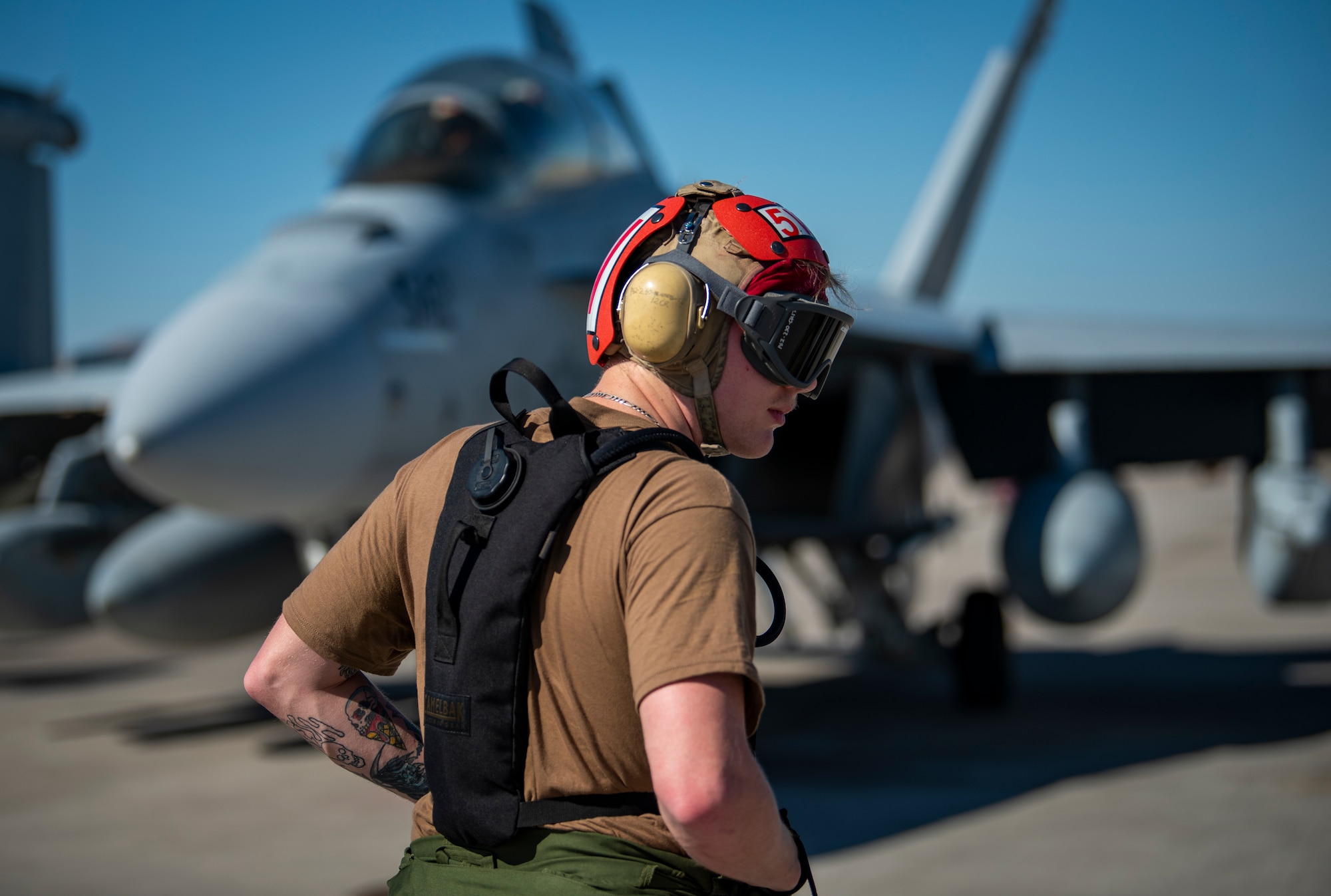 Airman stands on the flight line.