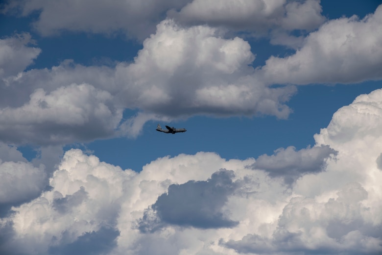 A C-130J Super Hercules assigned to the 41st Airlift Squadron flies above the flightline during pre-deployment training at Montrose Regional Airport, Colorado, July 29, 2020. This training environment helped the 41st AS familiarize the crews to mountainous terrain and high pressure altitudes similar to what they will encounter in their area of responsibility overseas. (U.S. Air Force photo by Airman 1st Class Aaron Irvin)