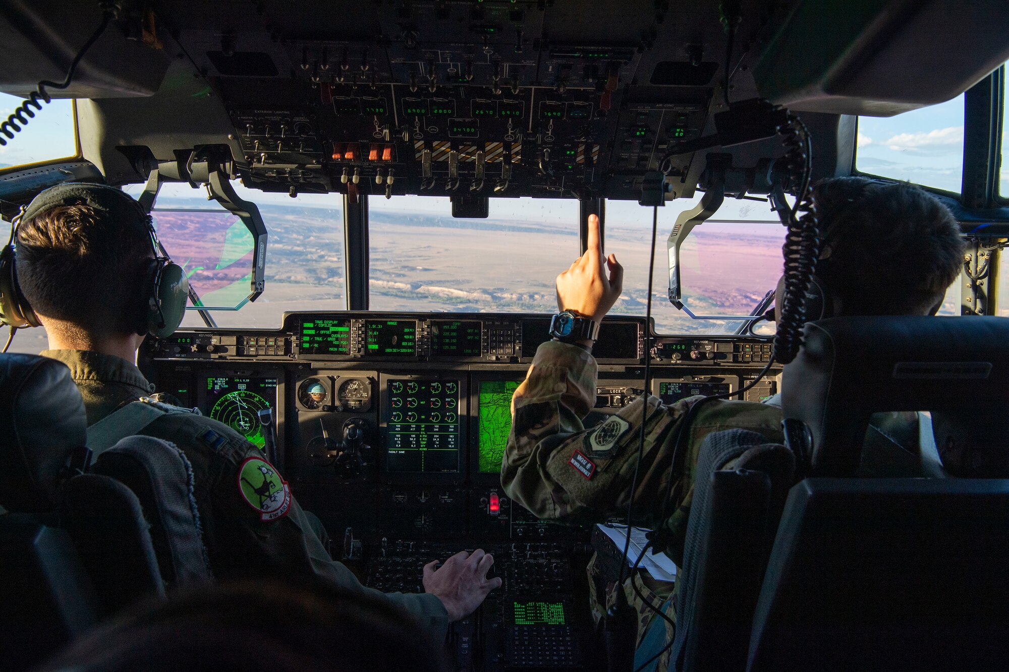 Pilots from the 41st Airlift Squadron fly a C-130J Super Hercules during pre-deployment training in Colorado, July 30, 2020. Throughout the training, the 41st AS was able to perform airdrops, offload cargo, fly low-levels, land on dirt runways, integrate with other wings, operate in low-light environments and navigate topography that the squadron is unable to replicate at home station. (U.S. Air Force photo by Airman 1st Class Aaron Irvin)