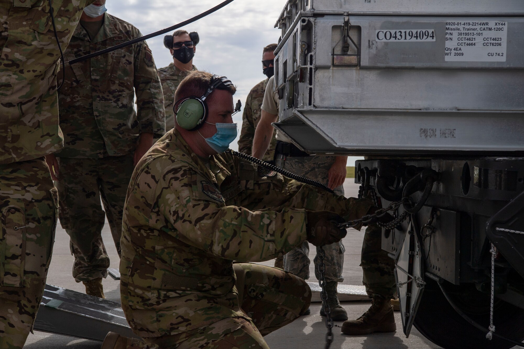 Members from the 41st Airlift Squadron and the 140th Wing, Colorado Air National Guard load cargo onto a C-130J Super Hercules during pre-deployment training at Buckley Air Force Base, Colorado, July 27, 2020. The 4/12 deployment initiative, which was developed in 2019 between airlift squadrons from Dyess AFB, Texas and Little Rock AFB, allowing each squadron a full year of dwell time followed by a four-month rotation to their respective area of responsibility. (U.S. Air Force photo by Airman 1st Class Aaron Irvin)