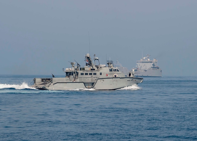200714-N-FO574-1022 ARABIAN GULF (July 14, 2020) A Mark VI patrol boat (front), assigned to Commander, Task Force (CTF) 56 escorts the logistics support vessel Maj. Gen. Charles P. Gross (LSV 5) in the Arabian Gulf, July 14, 2020. CTF 56 is responsible for planning and execution of expeditionary missions, including coastal riverine operations, in the U.S. 5th Fleet area of operations. (U.S. Navy photo by Mass Communication Specialist 3rd Class Jordan R. Bair/Released)