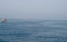 200714-N-FO574-1015 ARABIAN GULF (July 14, 2020) A Mark VI patrol boat (left), assigned to Commander, Task Force (CTF) 56, and coastal patrol ship USS Monsoon (PC 4) (center), assigned to CTF 55, escort logistics support vessel Maj. Gen. Charles P. Gross (LSV 5) (right) in the Arabian Gulf, July 14, 2020. CTF 56 is responsible for planning and execution of expeditionary missions, including coastal riverine operations, in the U.S. 5th Fleet area of operations. (U.S. Navy photo by Mass Communication Specialist 3rd Class Jordan R. Bair/Released)