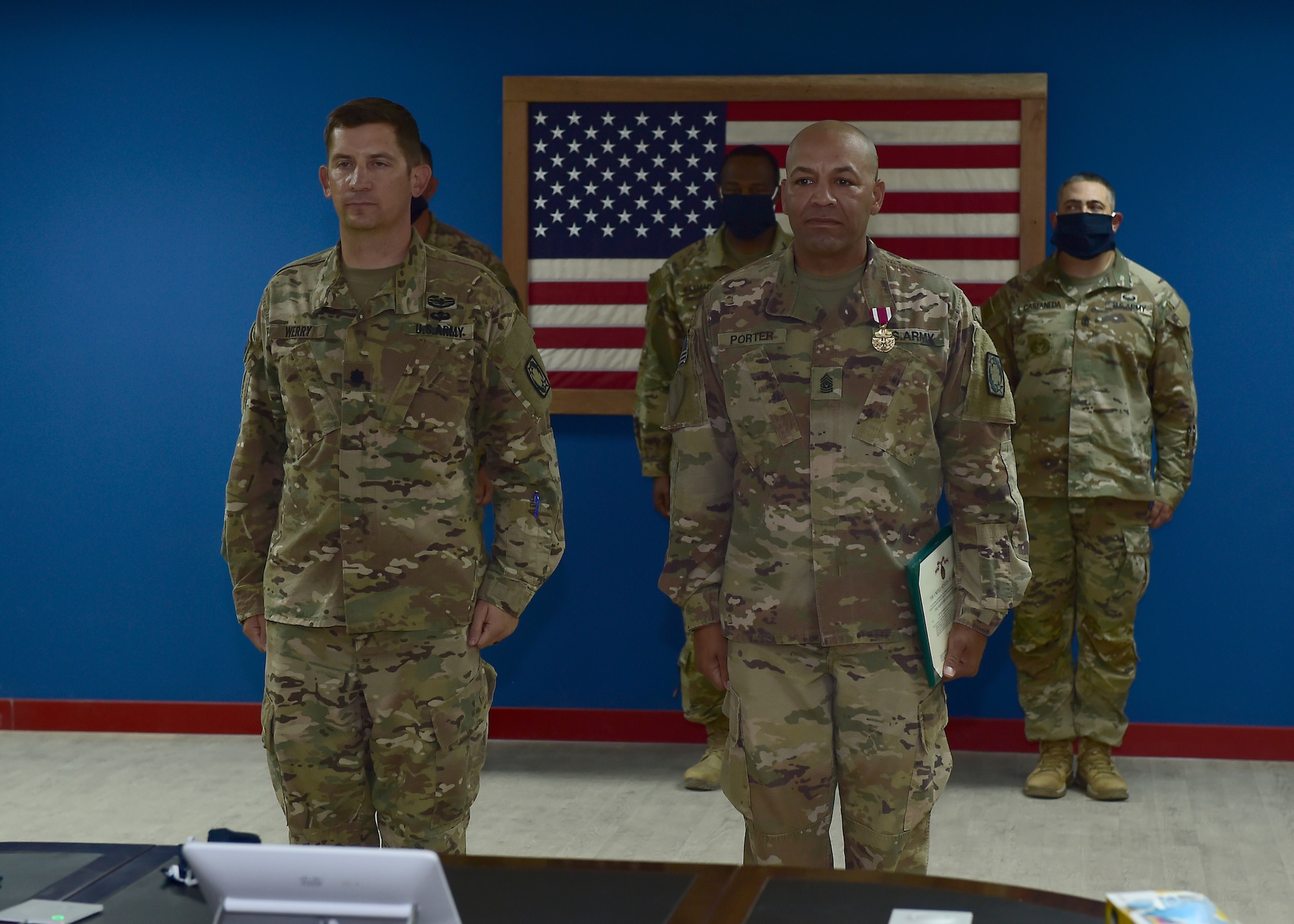 U.S. Army CSM Seagram Porter, outgoing command sergeant major, relinquishes responsibility of the 4-5 Air Defense Artillery Regiment to CSM Tomas Barrios during a Change of Responsibility Ceremony at Prince Sultan Air Base, Kingdom of Saudi Arabia.