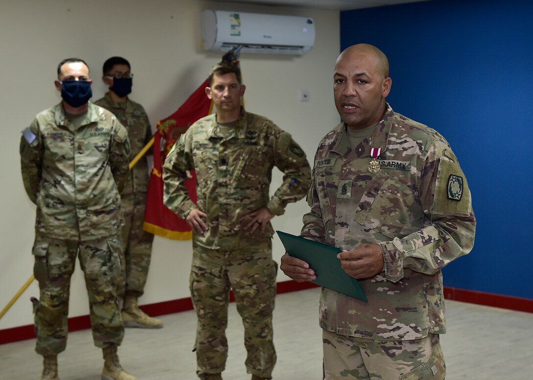 U.S. Army CSM Seagram Porter, outgoing command sergeant major, relinquishes responsibility of the 4-5 Air Defense Artillery Regiment to CSM Tomas Barrios during a Change of Responsibility Ceremony at Prince Sultan Air Base, Kingdom of Saudi Arabia.