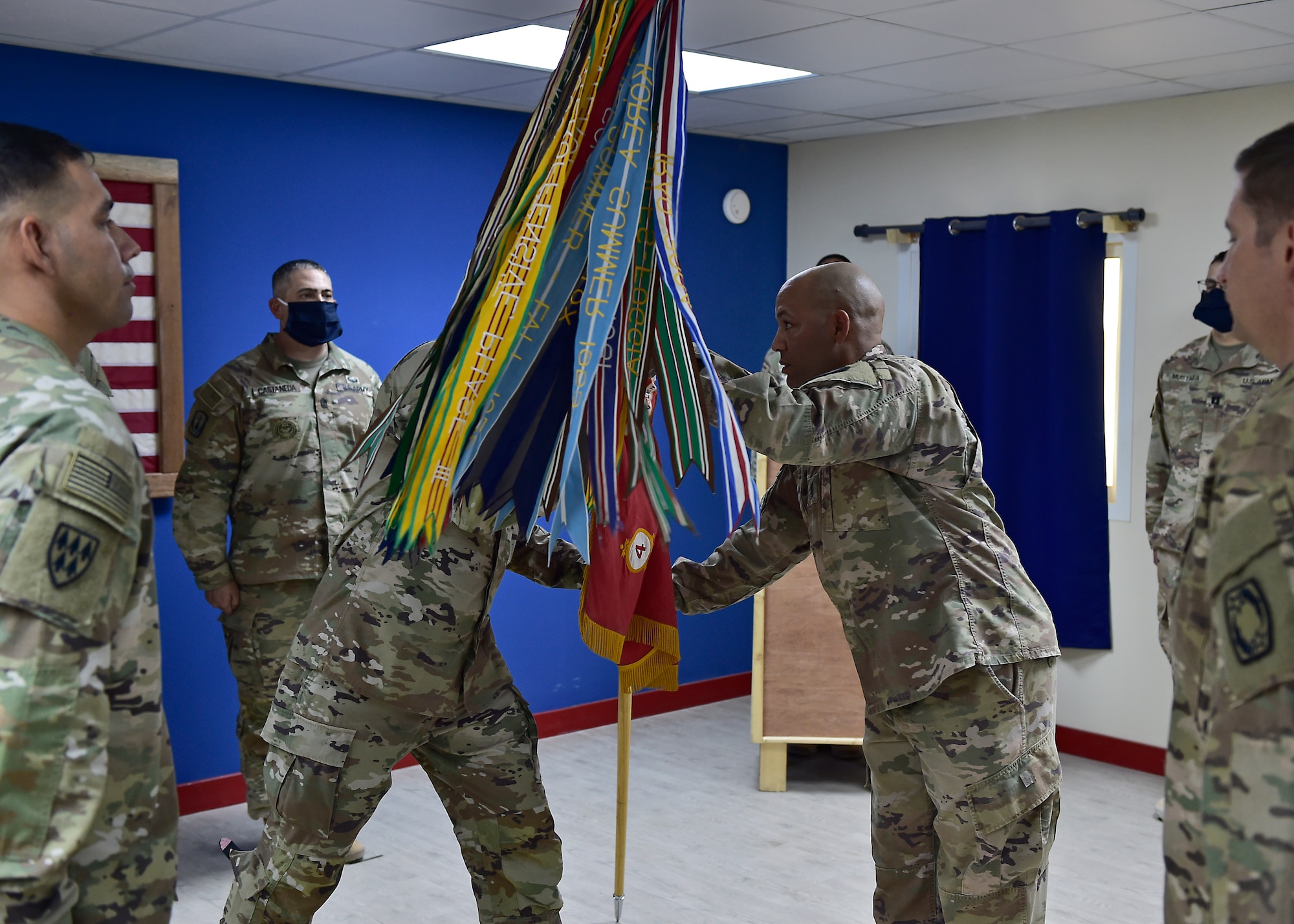 U.S. Army CSM Seagram Porter, outgoing command sergeant major, relinquishes responsibility of the 4-5 Air Defense Artillery Regiment to CSM Tomas Barrios during a Change of Responsibility Ceremony at Prince Sultan Air Base, Kingdom of Saudi Arabia.