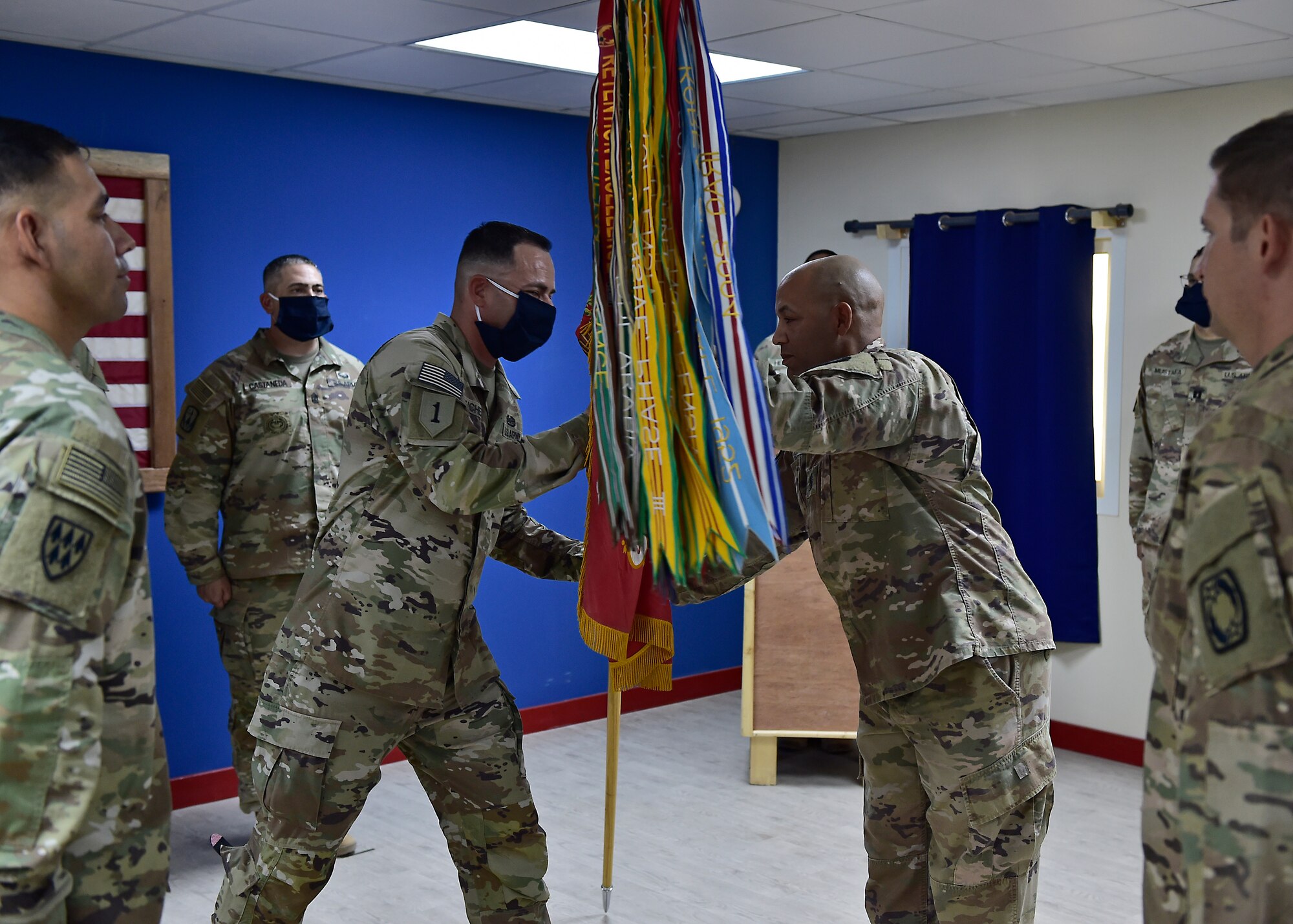 U.S. Army CSM Seagram Porter, outgoing command sergeant major, relinquishes responsibility of the 4-5 Air Defense Artillery Regiment to CSM Tomas Barrios during a Change of Responsibility Ceremony at Prince Sultan Air Base, Kingdom of Saudi Arabia.