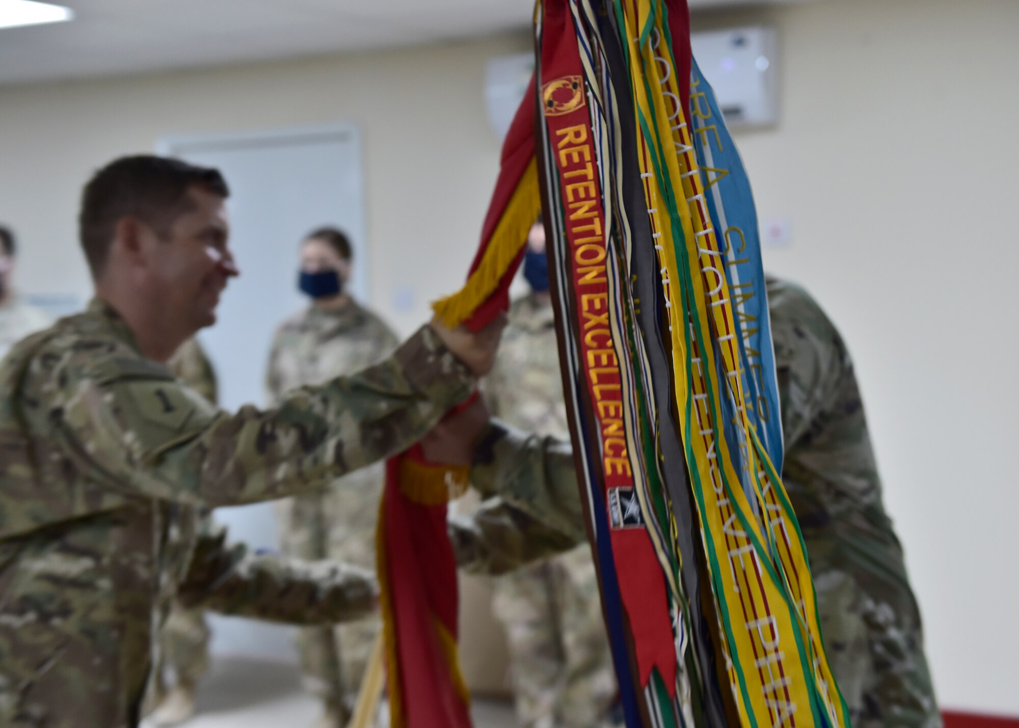 U.S. Army CSM Seagram Porter, outgoing command sergeant major, relinquishes responsibility of the 4-5 Air Defense Artillery Regiment to CSM Tomas Barrios during a Change of Responsibility Ceremony at Prince Sultan Air Base, Kingdom of Saudi Arabia.