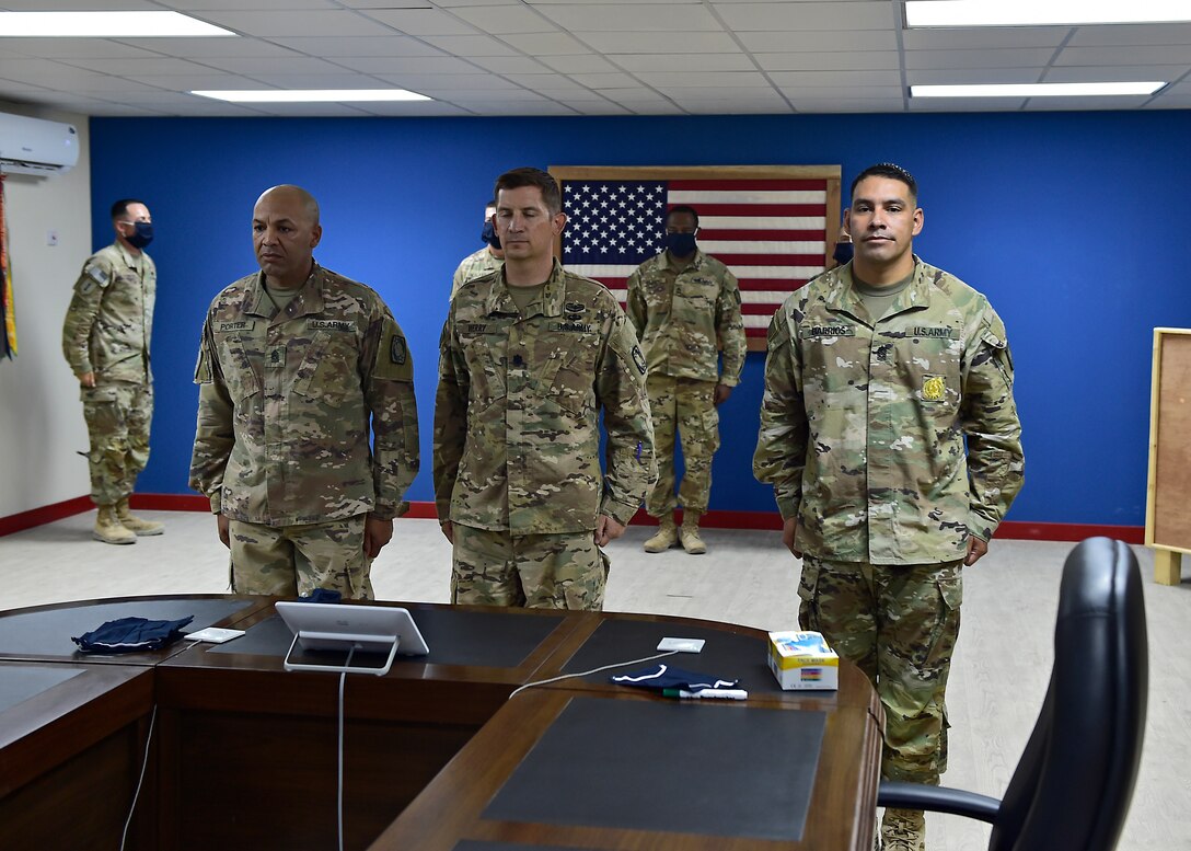 U.S. Army CSM Seagram Porter, outgoing command sergeant major, relinquishes responsibility of the 4-5 Air Defense Artillery Regiment to CSM Tomas Barrios during a Change of Responsibility Ceremony at Prince Sultan Air Base, Kingdom of Saudi Arabia.