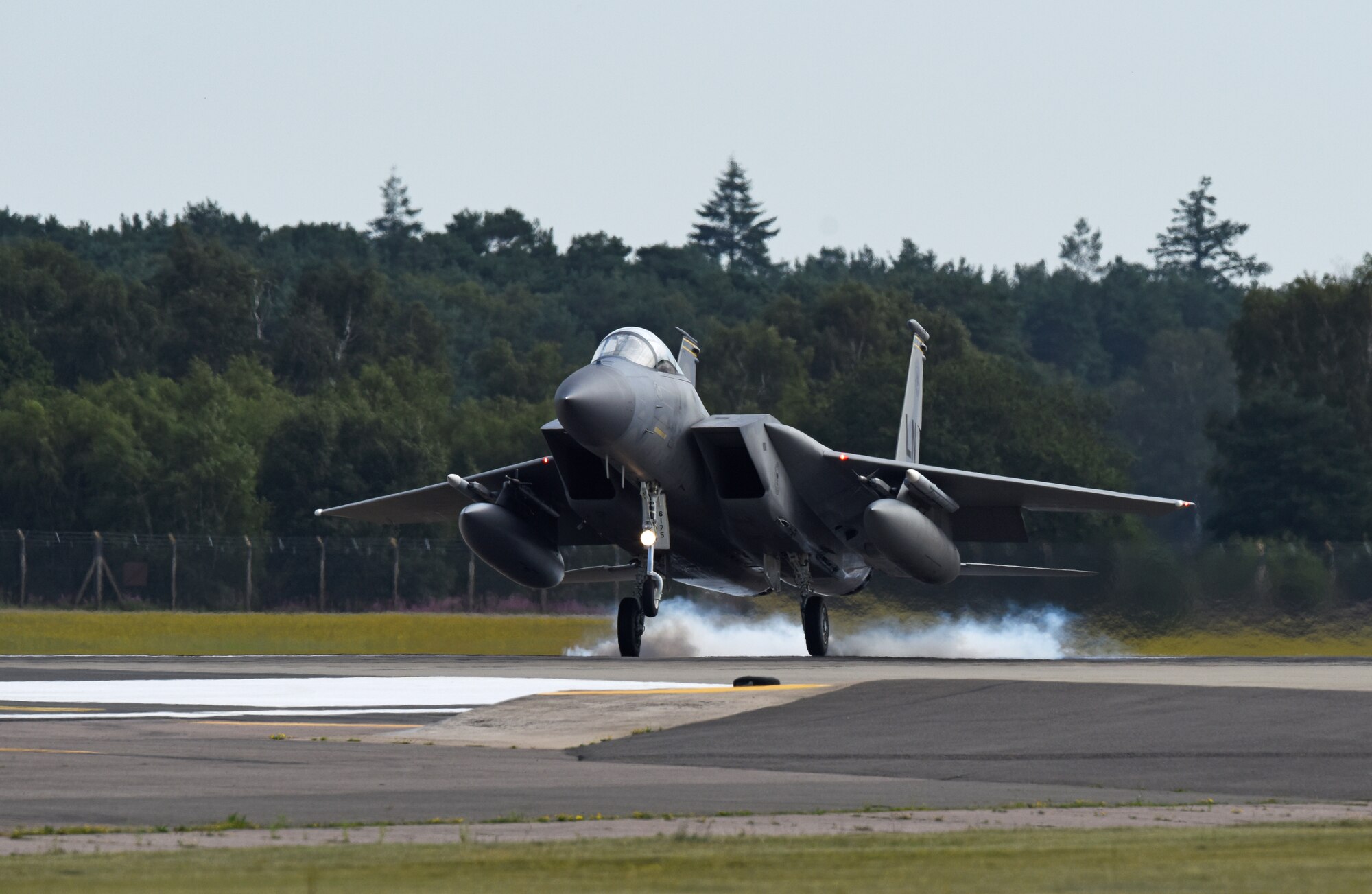 An F-15C Eagle, assigned to the 493rd Fighter Squadron, lands at Royal Air Force Lakenheath, England, Aug. 4, 2020. The Liberty Wing F-15s provide worldwide responsive combat airpower and support through its highly capable maneuverability and acceleration, weapons systems and avionics. (U.S. Air Force photo by Airman 1st Class Rhonda Smith)