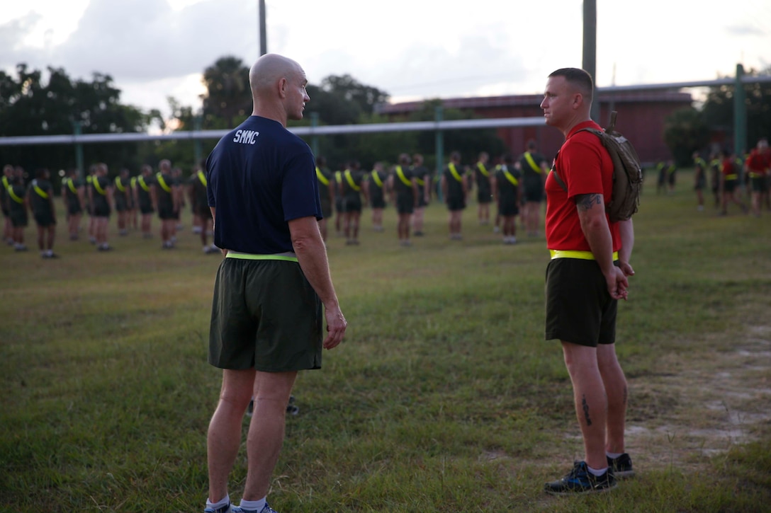 The 19th Sergeant Major of the Marine Corps, Sgt. Maj. Troy E. Black addresses Drill Instructors with 1st Recruit Training Battalion at Marine Corps Recruit Depot (MCRD) Parris Island, South Carolina, July 22, 2020. During the visit Sgt. Maj. Black toured the training facilities to observe changes made keep recruits and Drill Instructors safe during COVID-19 restrictions. The changes include the use of face masks when less than six feet apart, and smaller platoon sizes in addition to the 14 days of restriction of movement before new recruits start training. (U.S. Marine Corps photo by Sgt. Victoria Ross)