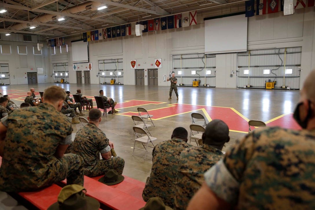 The 19th Sergeant Major of the Marine Corps, Sgt. Maj. Troy E. Black addresses Staff Non-Commissioned Officers at Marine Corps Recruit Depot (MCRD) Parris Island, S.C., July 22, 2020. During the visit Sgt. Maj. Black toured the training facilities to observe changes made keep recruits and Drill Instructors safe during COVID-19 restrictions. The changes include the use of face masks when less than six feet apart, and smaller platoon sizes in addition to the 14 days of restriction of movement before new recruits start training. (U.S. Marine Corps photo by Sgt. Victoria Ross)