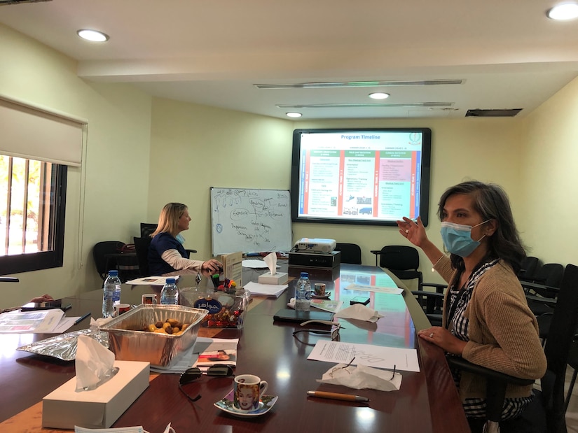 U.S. Army Dr (COL) Brigilda Teneza, right, and Navy CDR Amy White, left, brief the UAE medical student training proposal to Zayed Military Hospital Education staff.