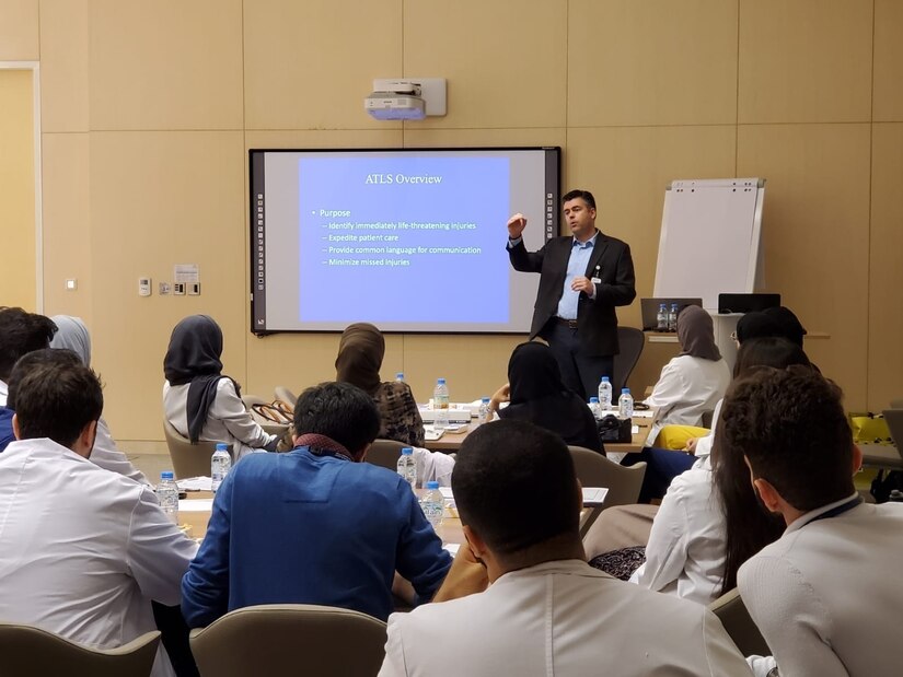 Air Force Lt. Col. Brian Gavitt, one of the joint U.S. service members of the Trauma, Burn, and Rehabilitative Medicine team (TBRM), briefs fellow medical officers and staff at the Sheikh Shakhbout Medical City in Abu Dhabi.