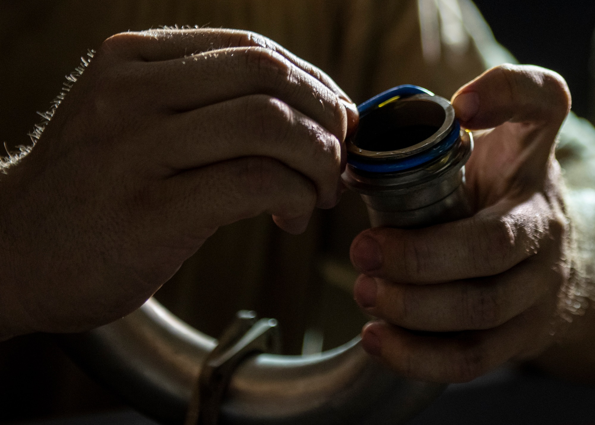 Tech. Sgt. Chance Gorham, 5th Expeditionary Air Mobility Squadron instruments and flight control systems craftsmen, attaches an O-ring to a fuel pump component.